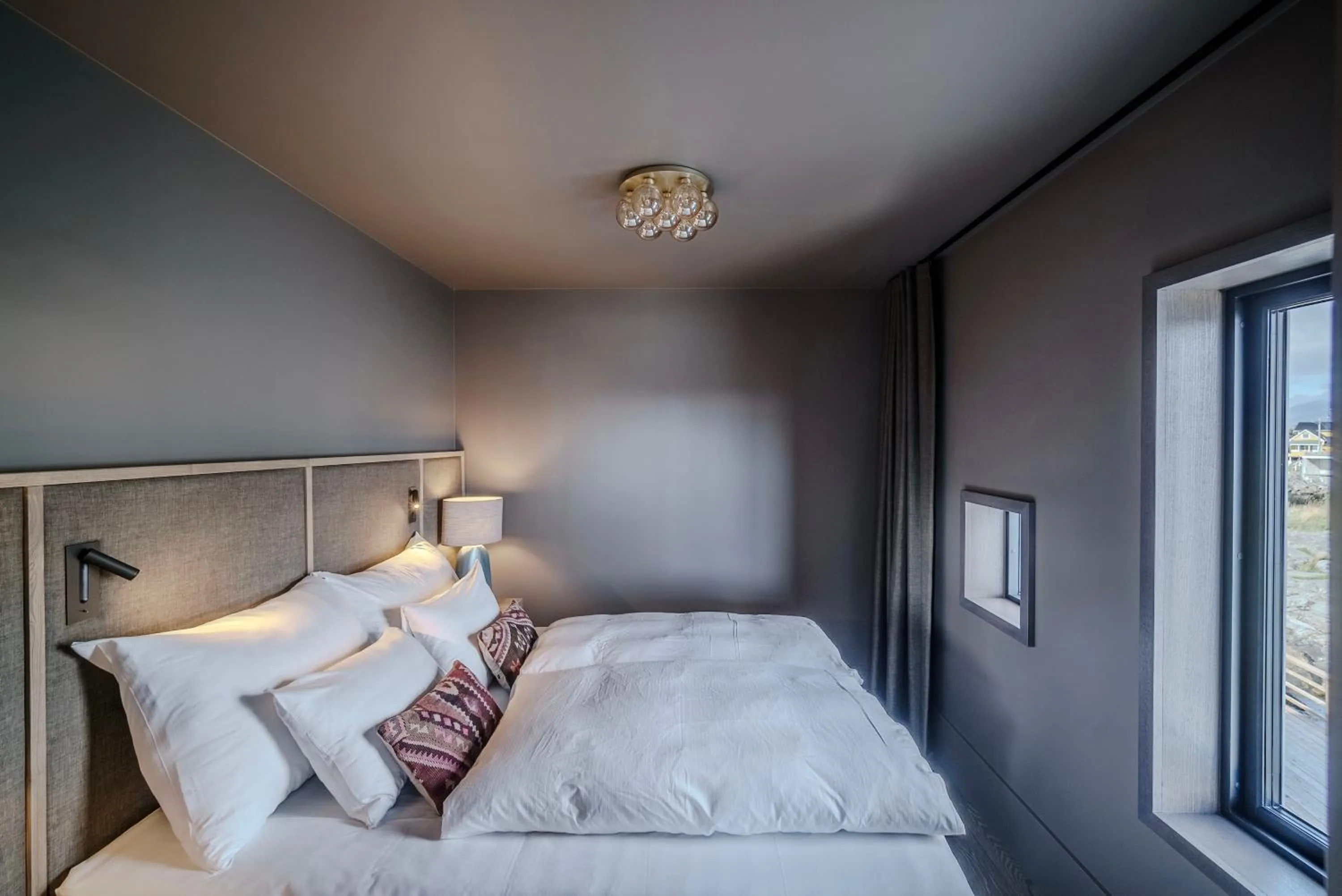 Bed in Henningsvær Bryggehotell - by Classic Norway Hotels