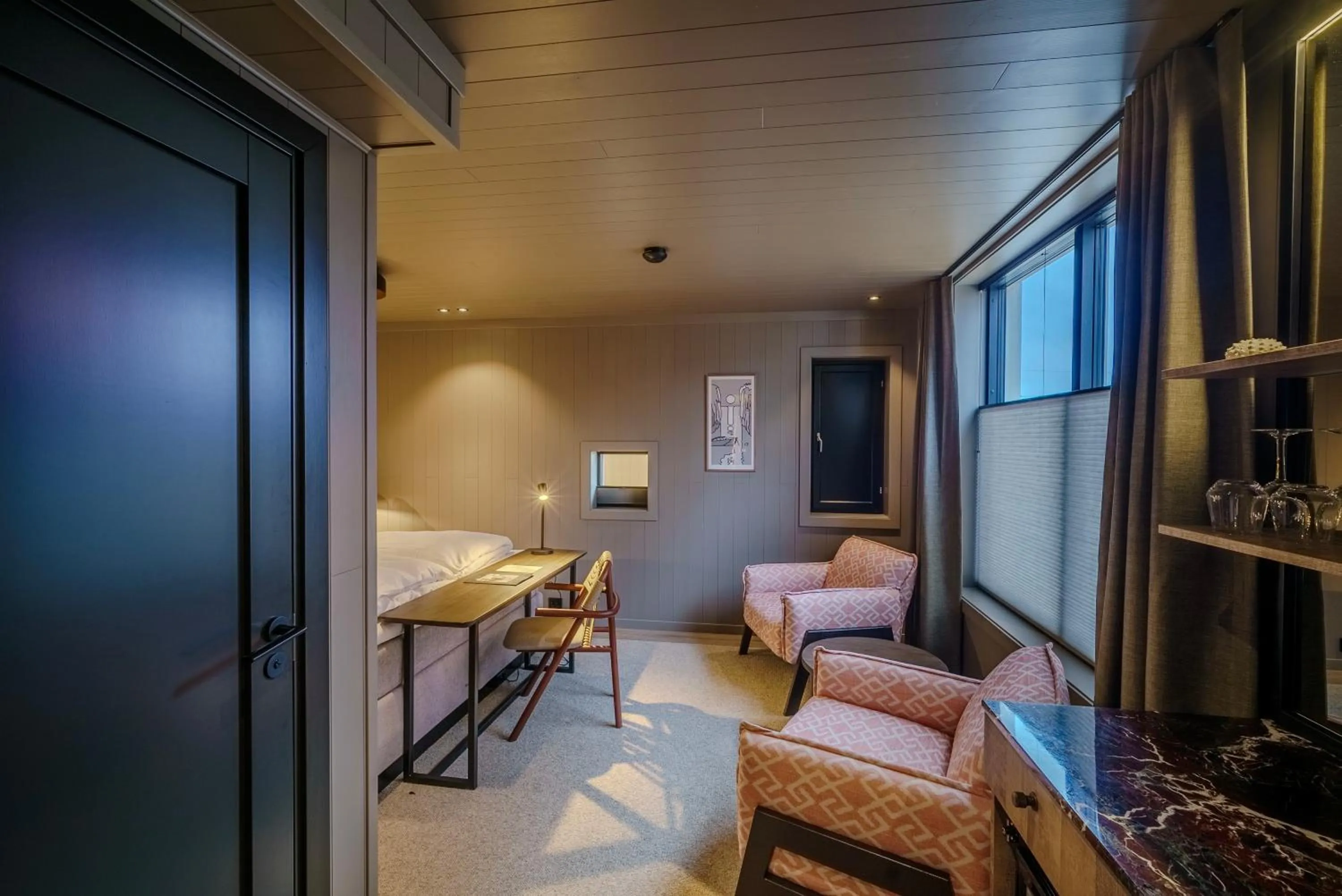 Photo of the whole room, Bed in Henningsvær Bryggehotell - by Classic Norway Hotels