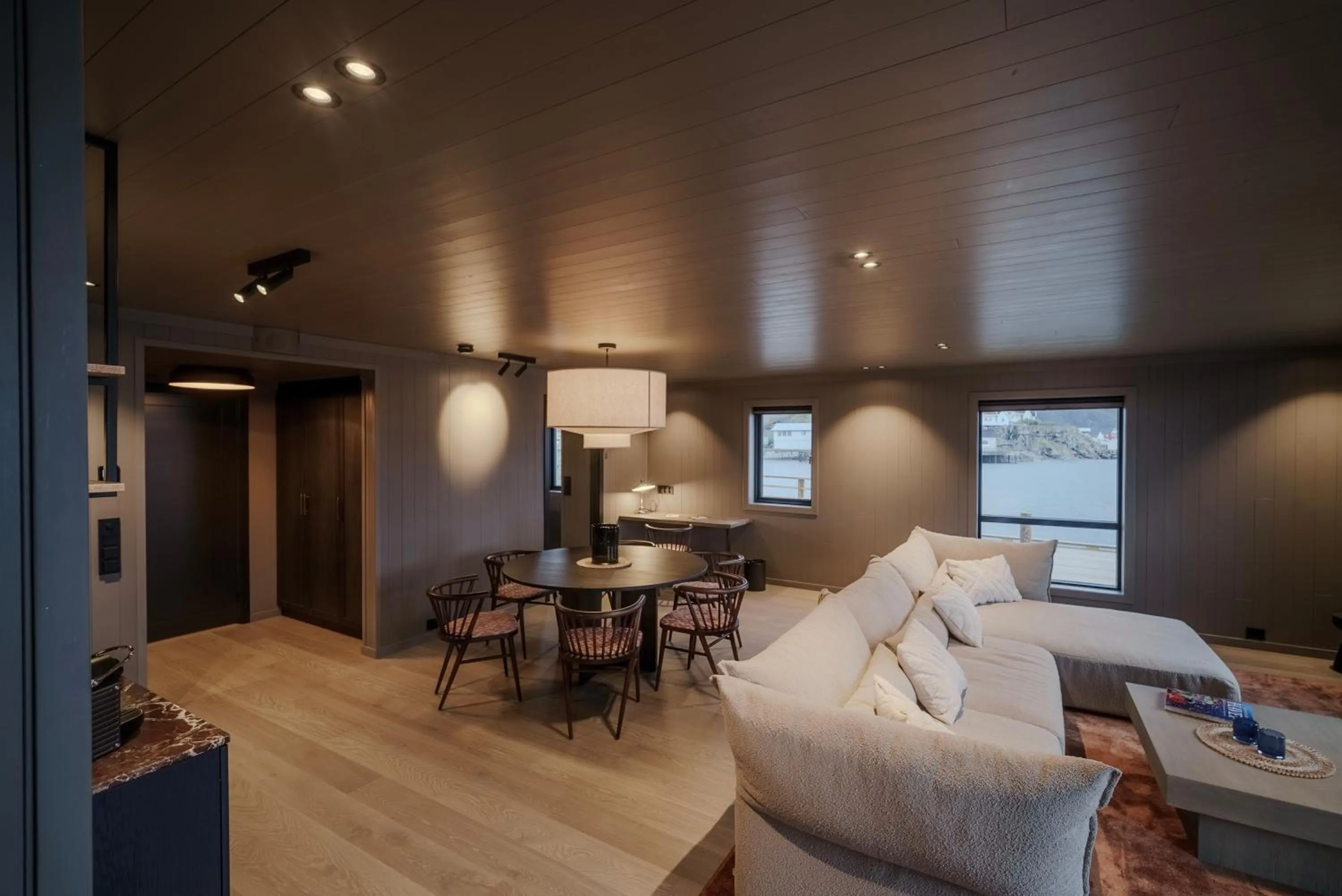 Living room, Bed in Henningsvær Bryggehotell - by Classic Norway Hotels