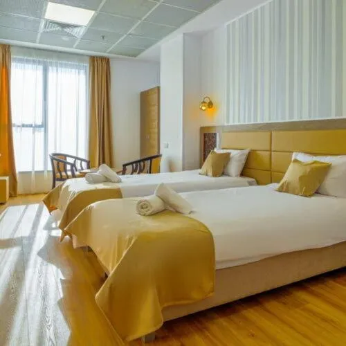 Bed in Sir Fundeni Hotel