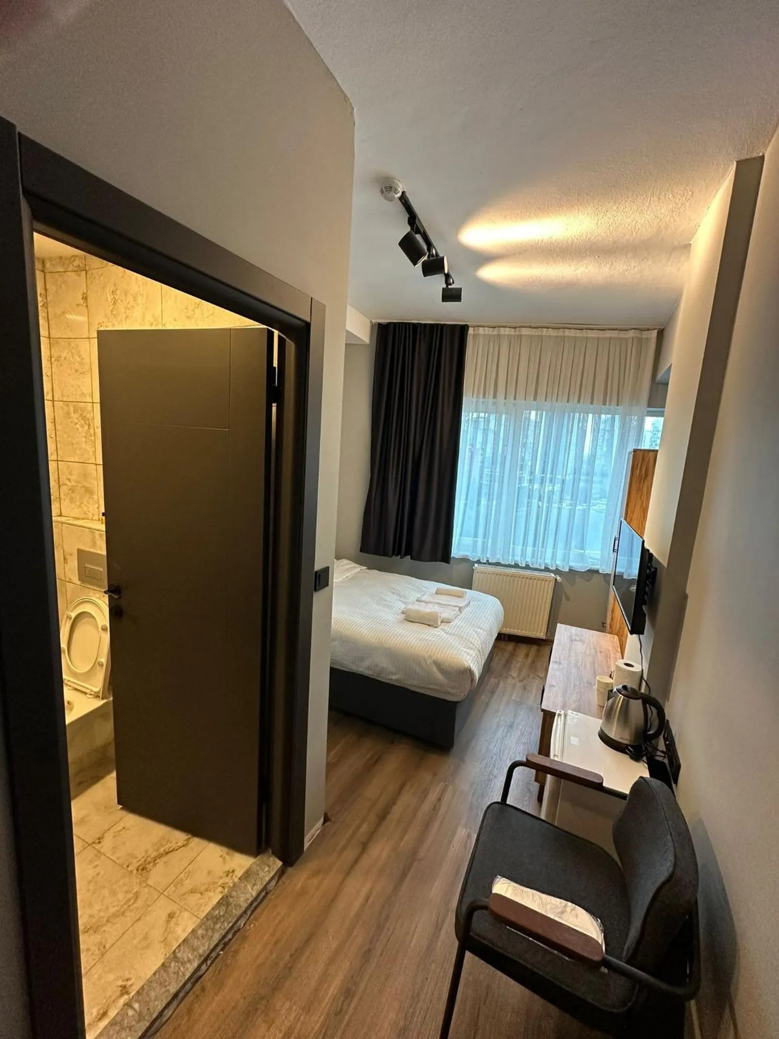 Bed in Lucca Suites Hotel