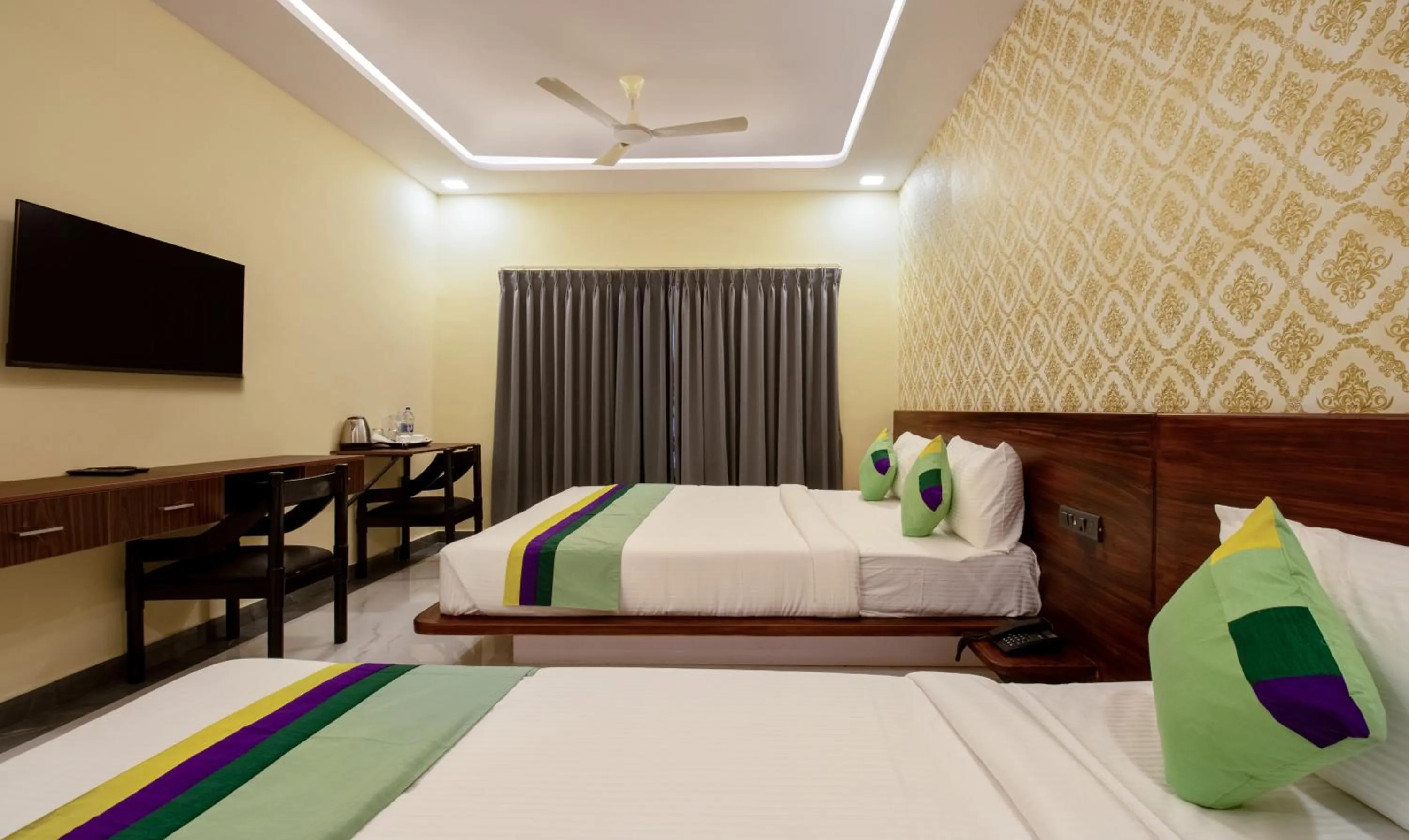 Bedroom in Treebo Jaguar Comforts, 3 Kms From Mahatma Gandhi Park