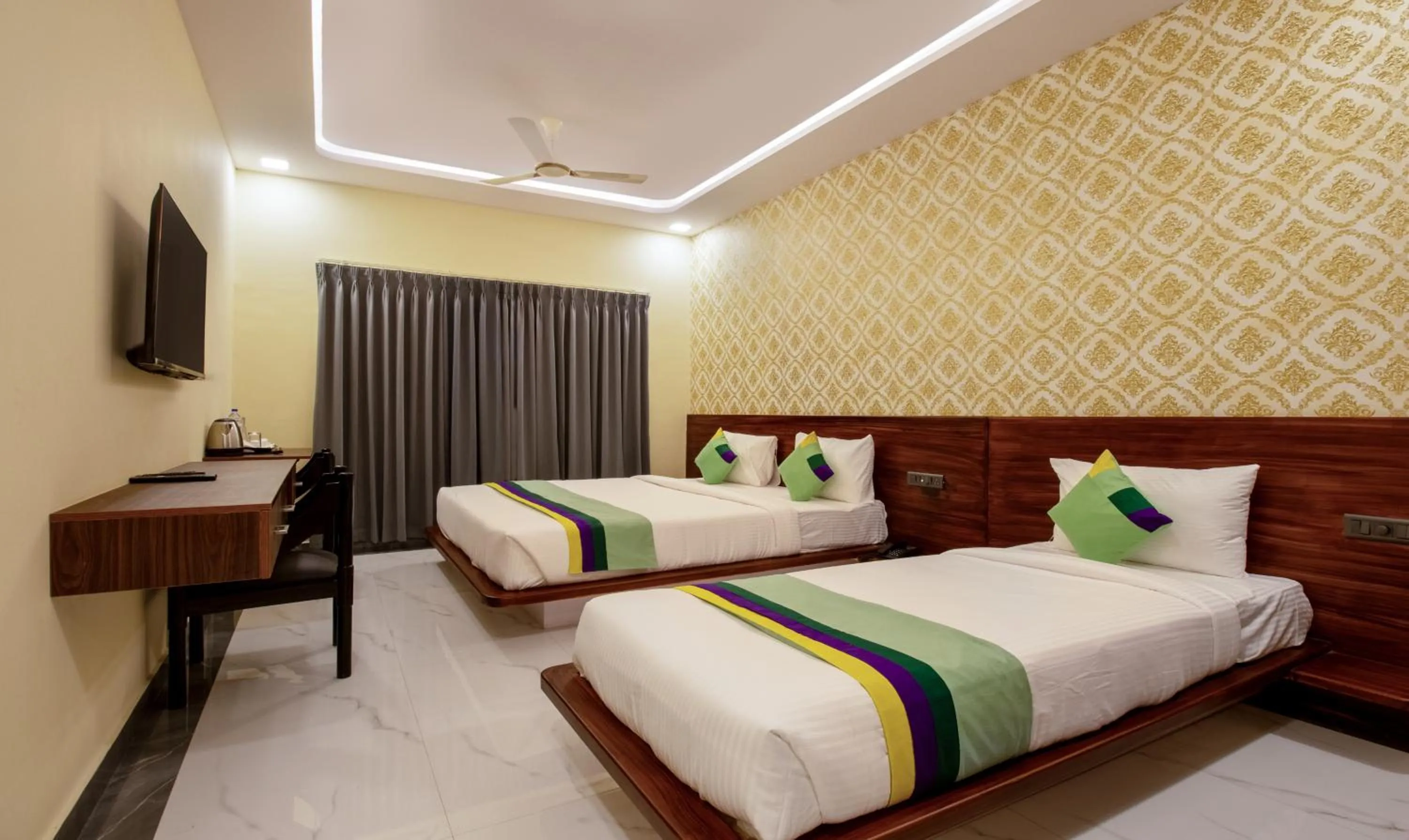 Bedroom in Treebo Jaguar Comforts, 3 Kms From Mahatma Gandhi Park