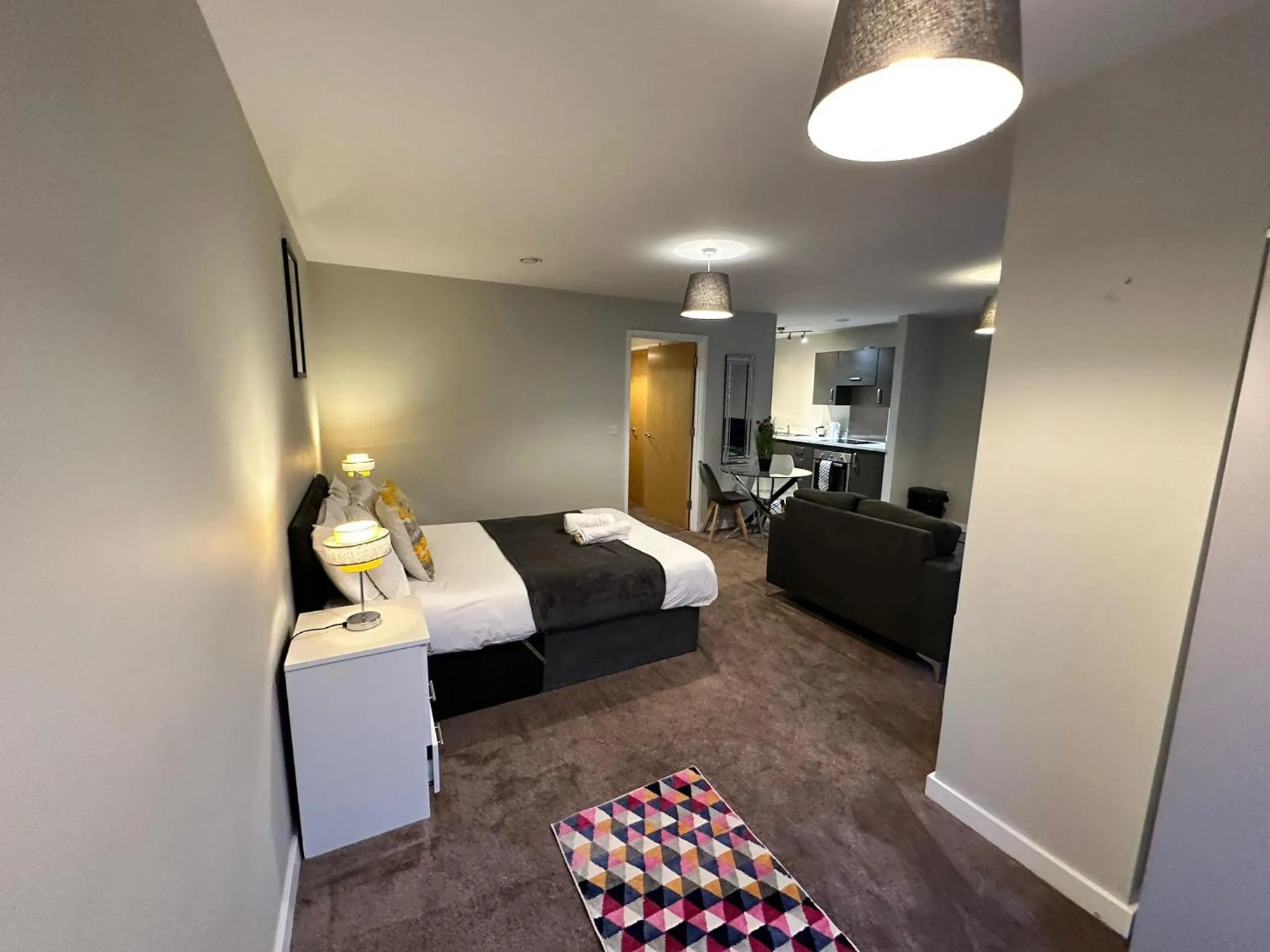 Living room, Bed in Adelphi Wharf Apartments by Beehosting