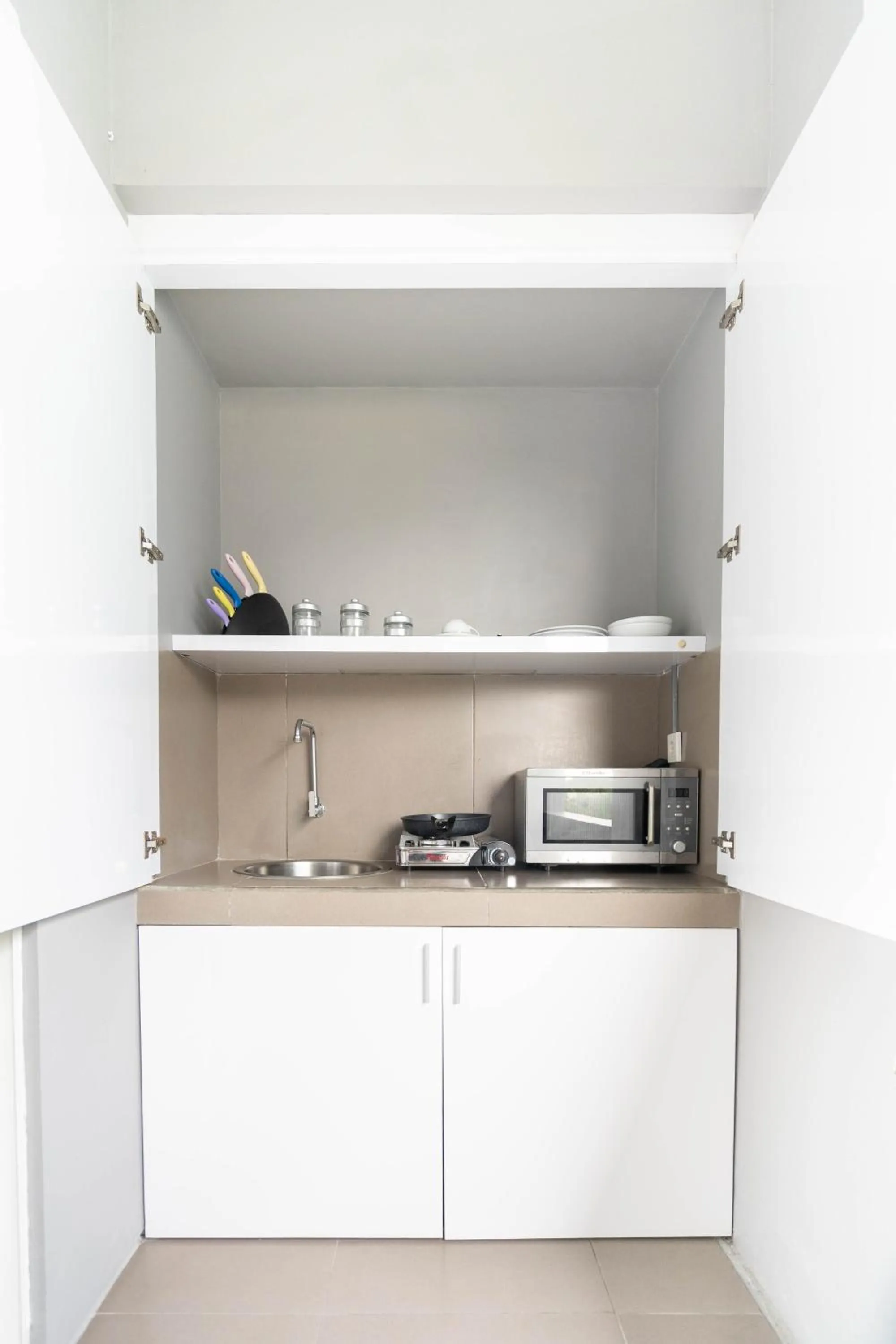 Kitchen or kitchenette in Cozy Stay Bali by ARM Hospitality