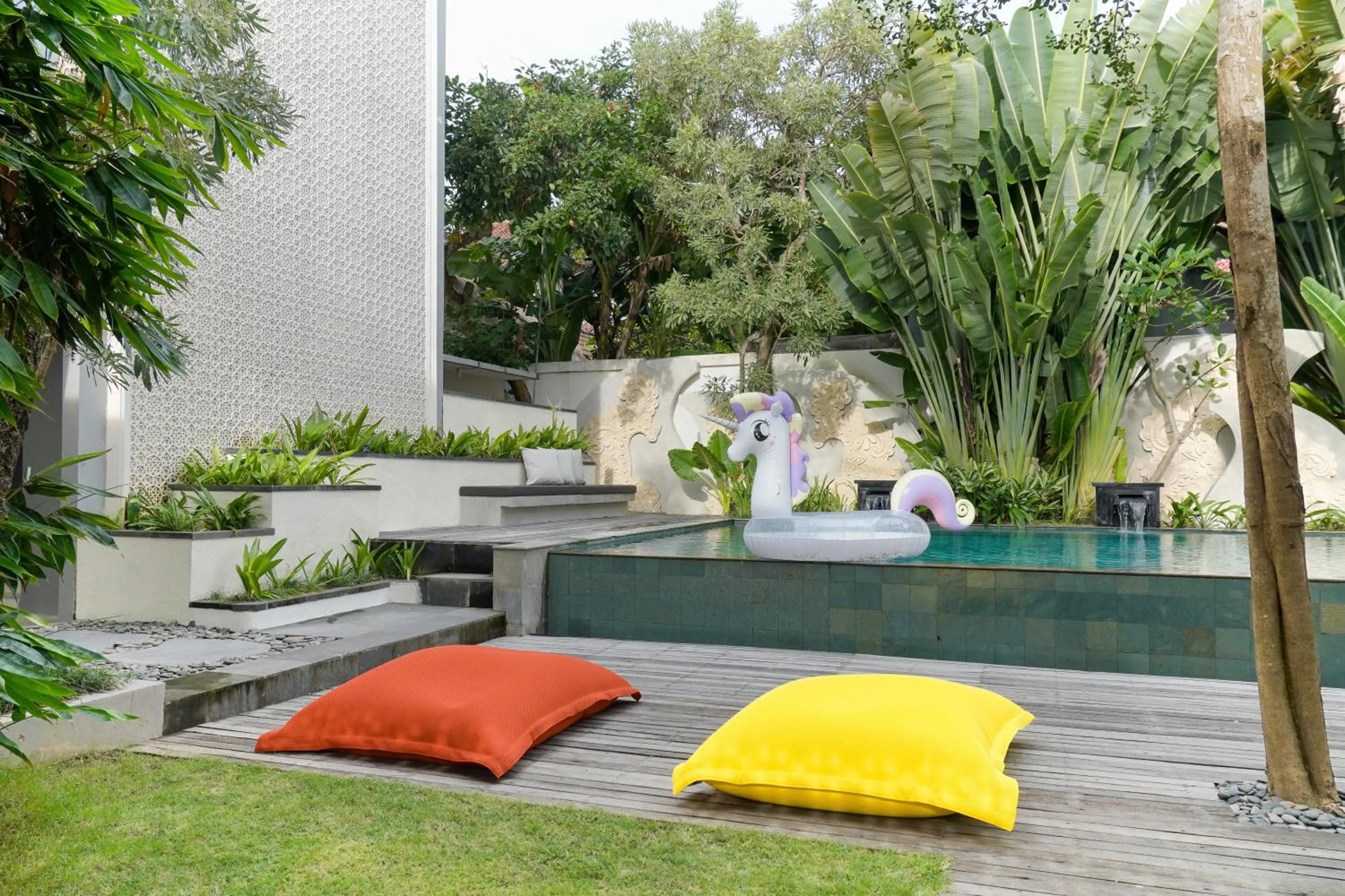 Swimming pool in Cozy Stay Bali by ARM Hospitality