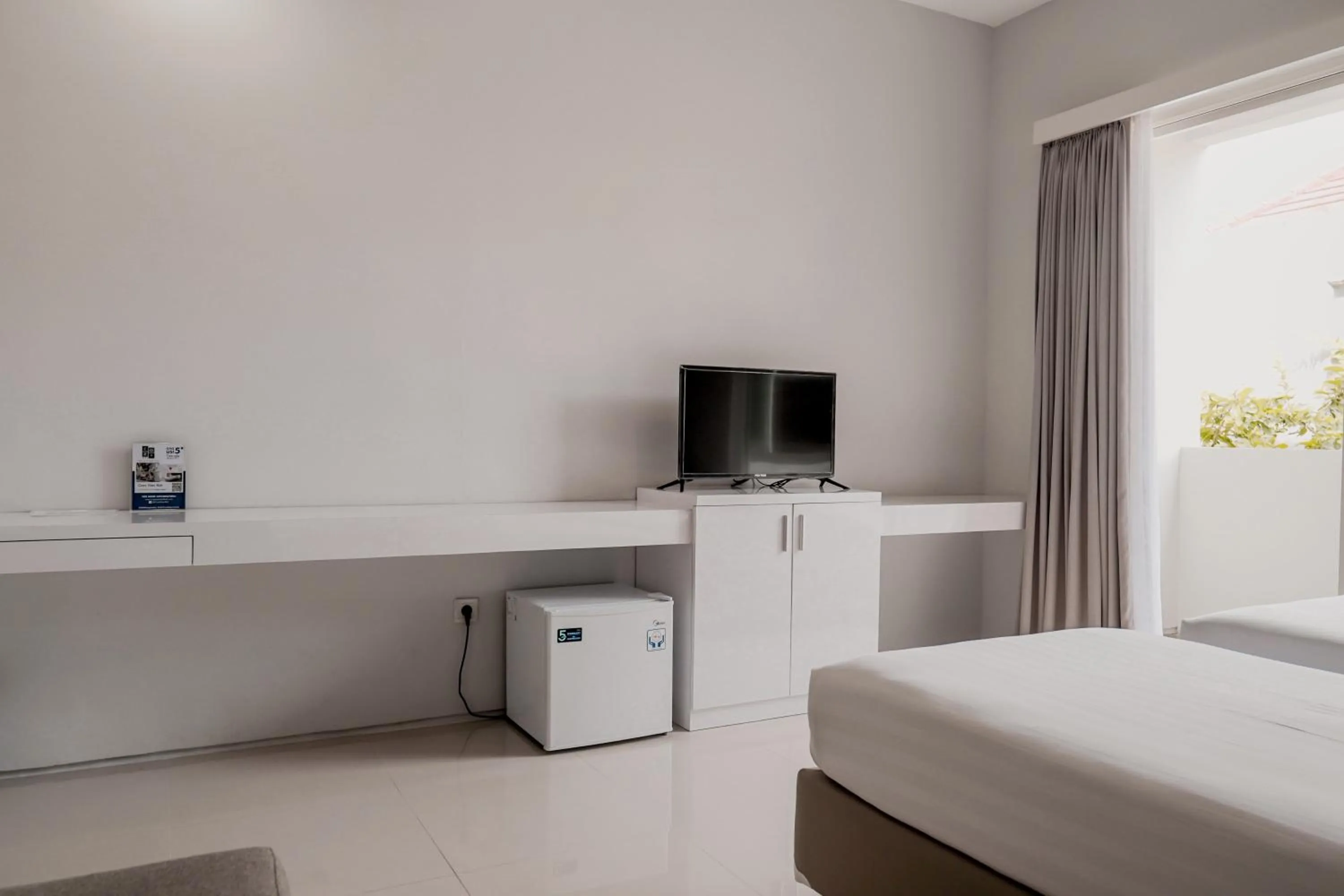 Bed in Cozy Stay Bali by ARM Hospitality