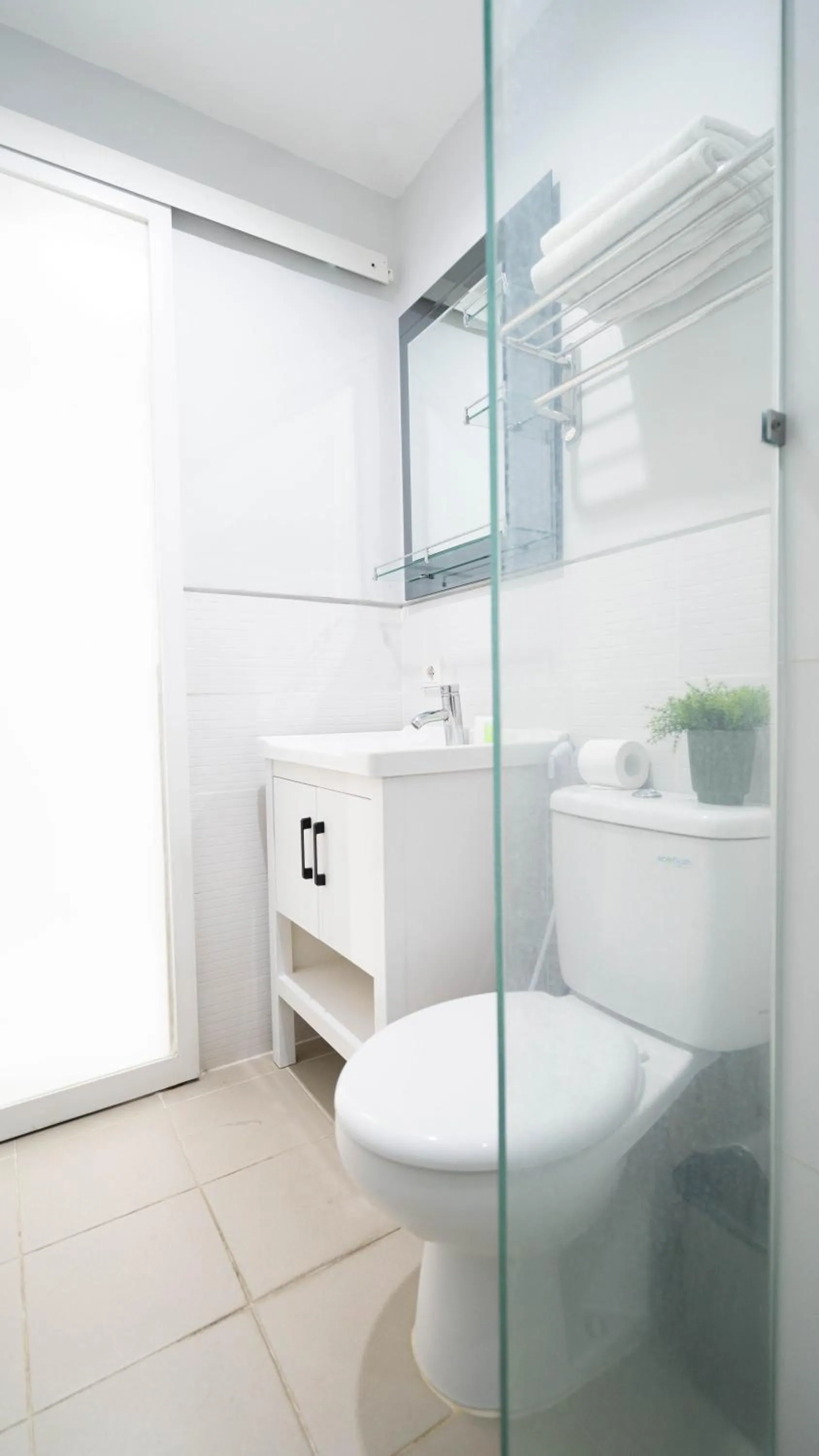 Shower in Cozy Stay Bali by ARM Hospitality