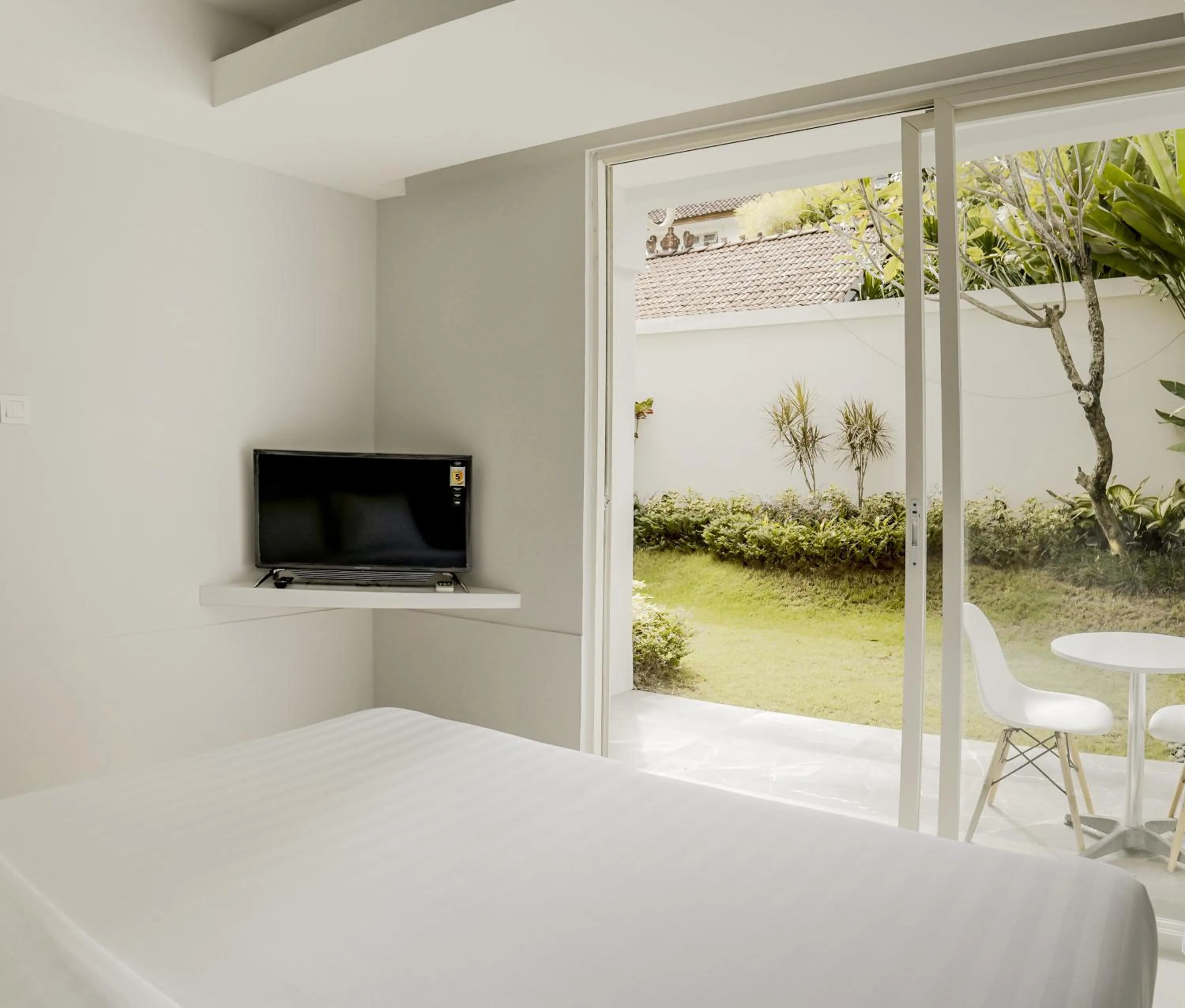 Communal lounge/ TV room, Bed in Cozy Stay Bali by ARM Hospitality