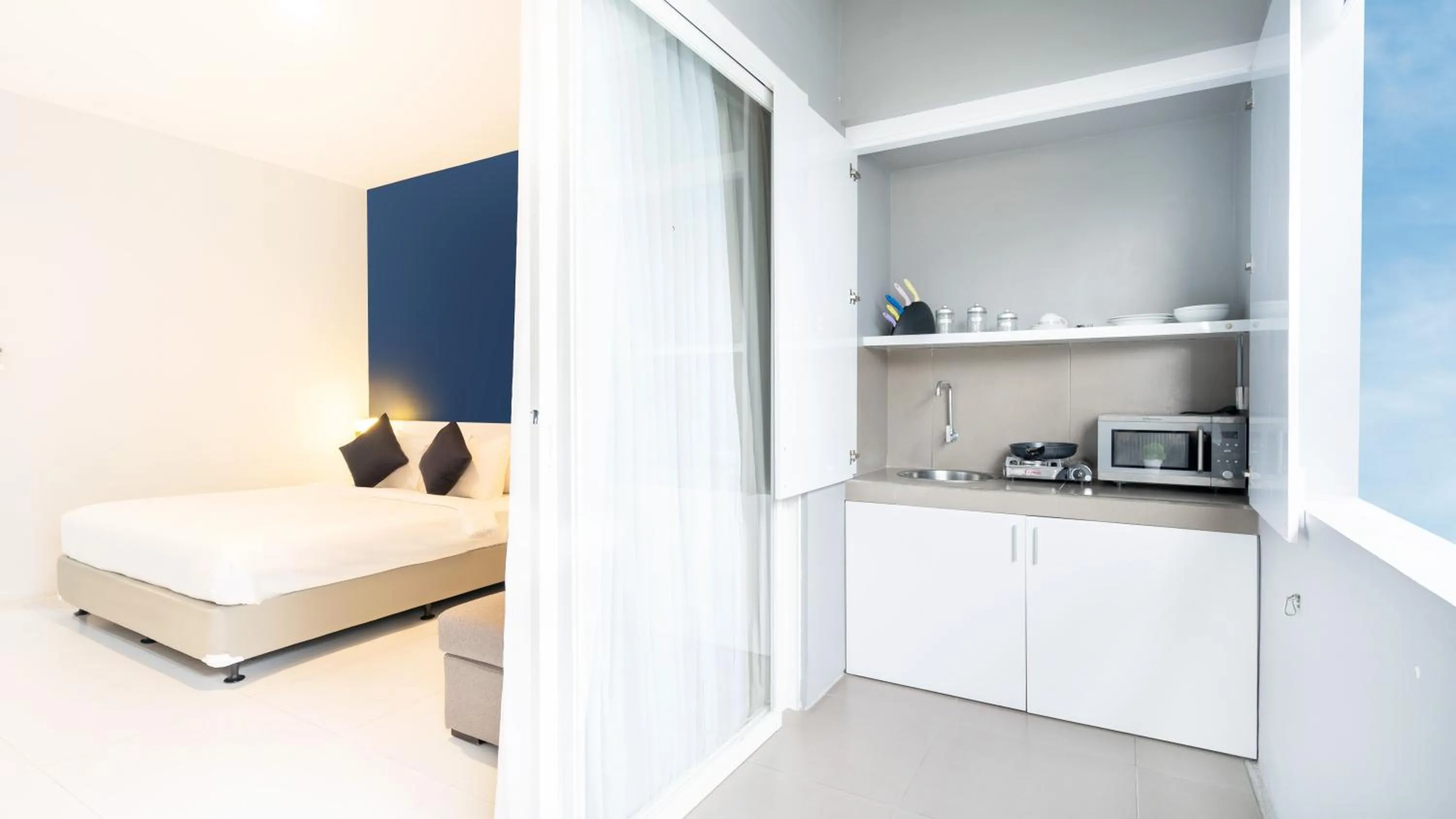 Bed in Cozy Stay Bali by ARM Hospitality