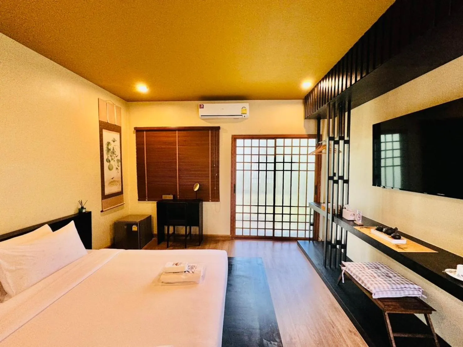 Bed in COZY SHIROI RESORT