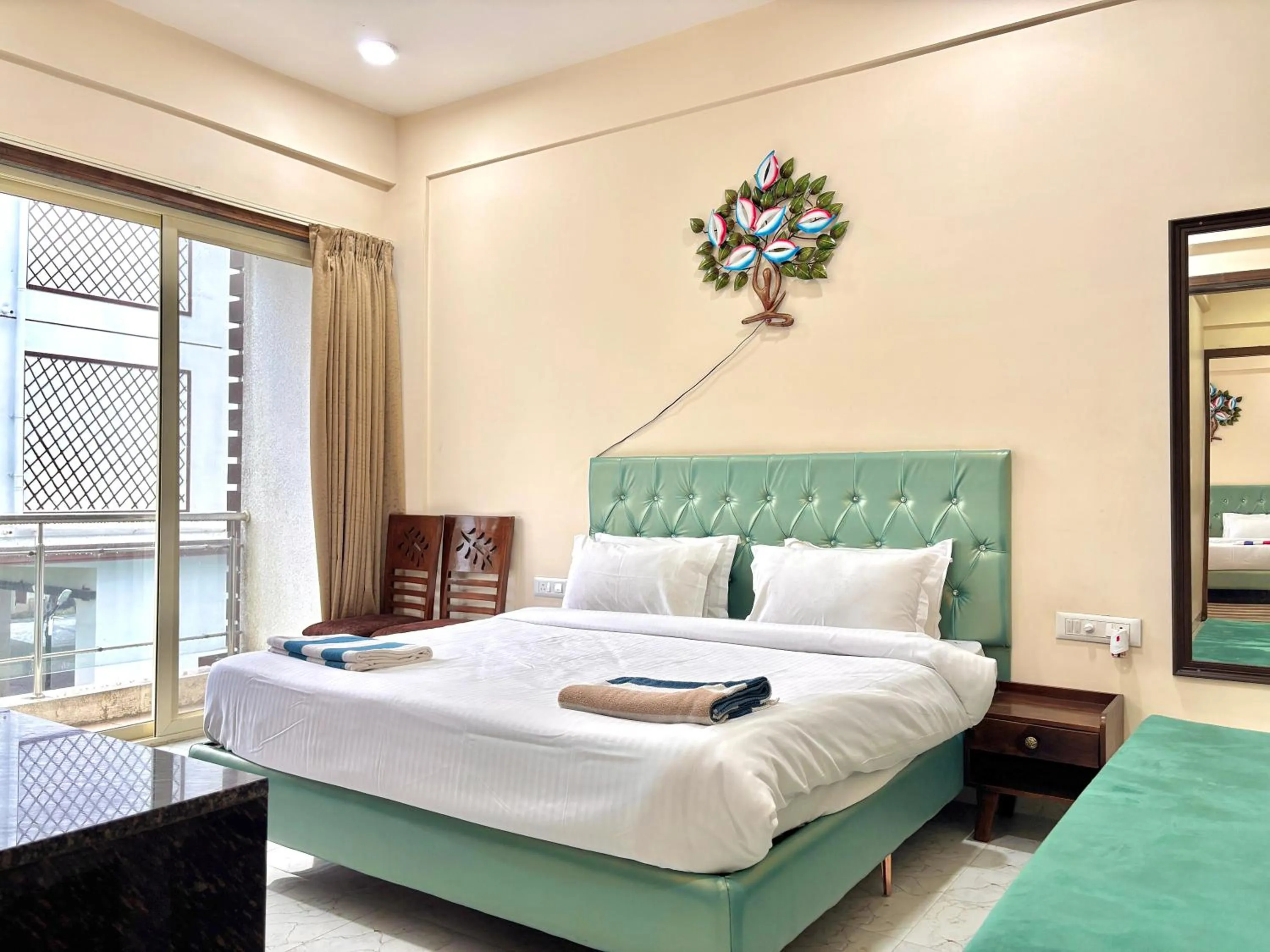 Bed in Misty Blues Resort & Villas