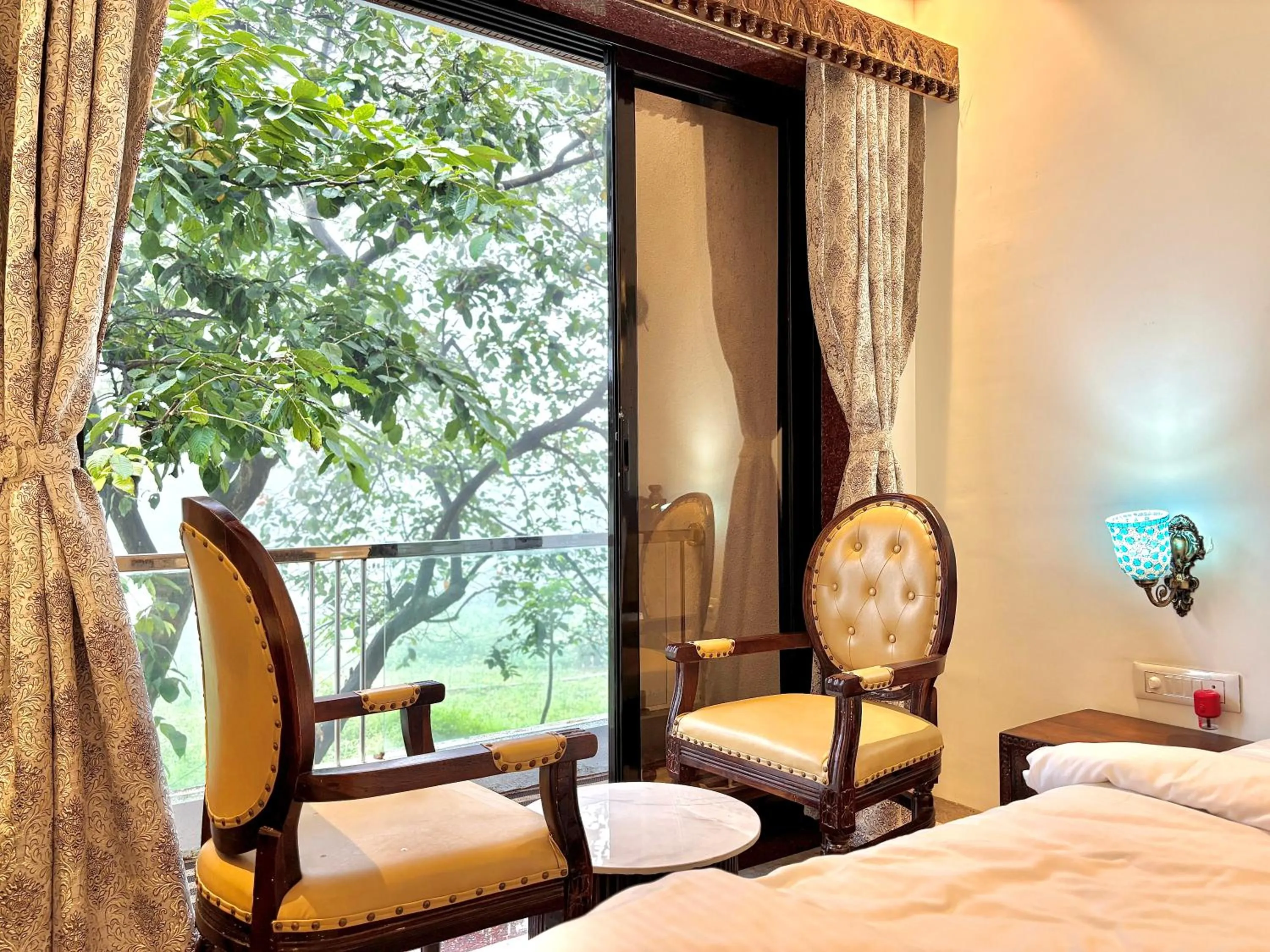 Seating area, Bed in Misty Blues Resort & Villas