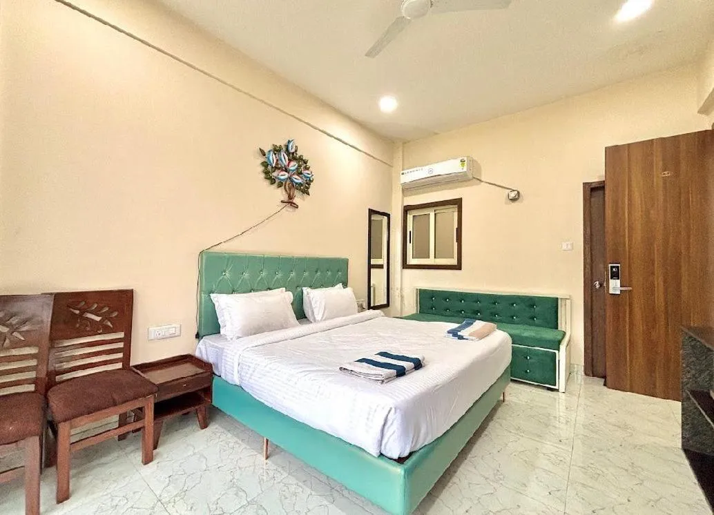 Bed in Misty Blues Resort & Villas