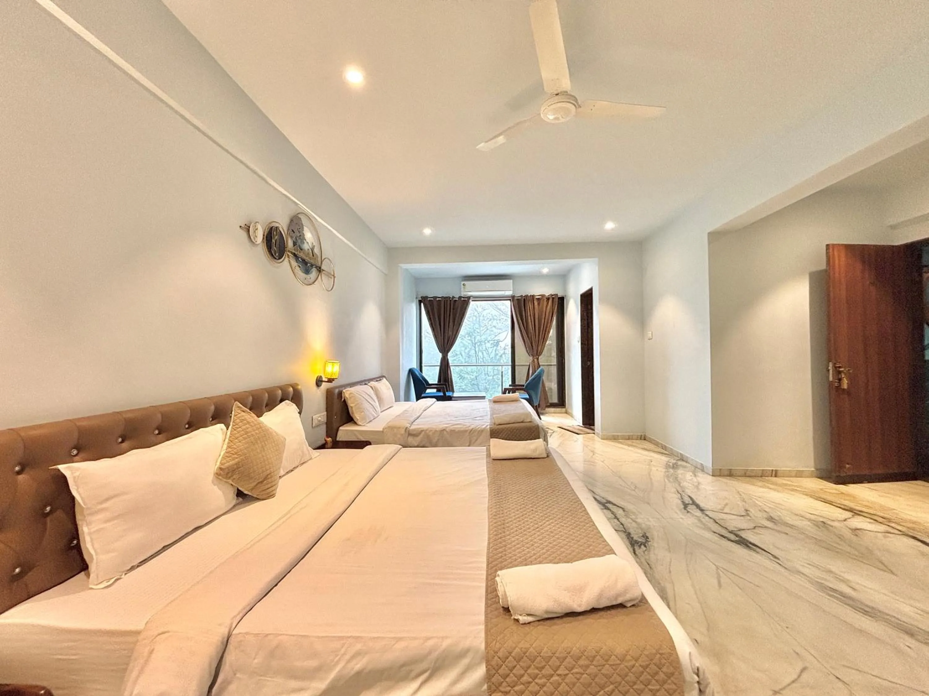 Seating area, Bed in Misty Blues Resort & Villas