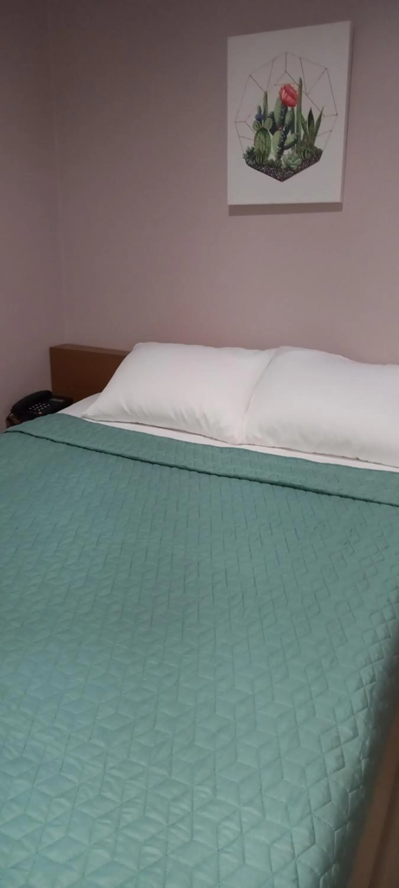 Bed in Lorraine Suites