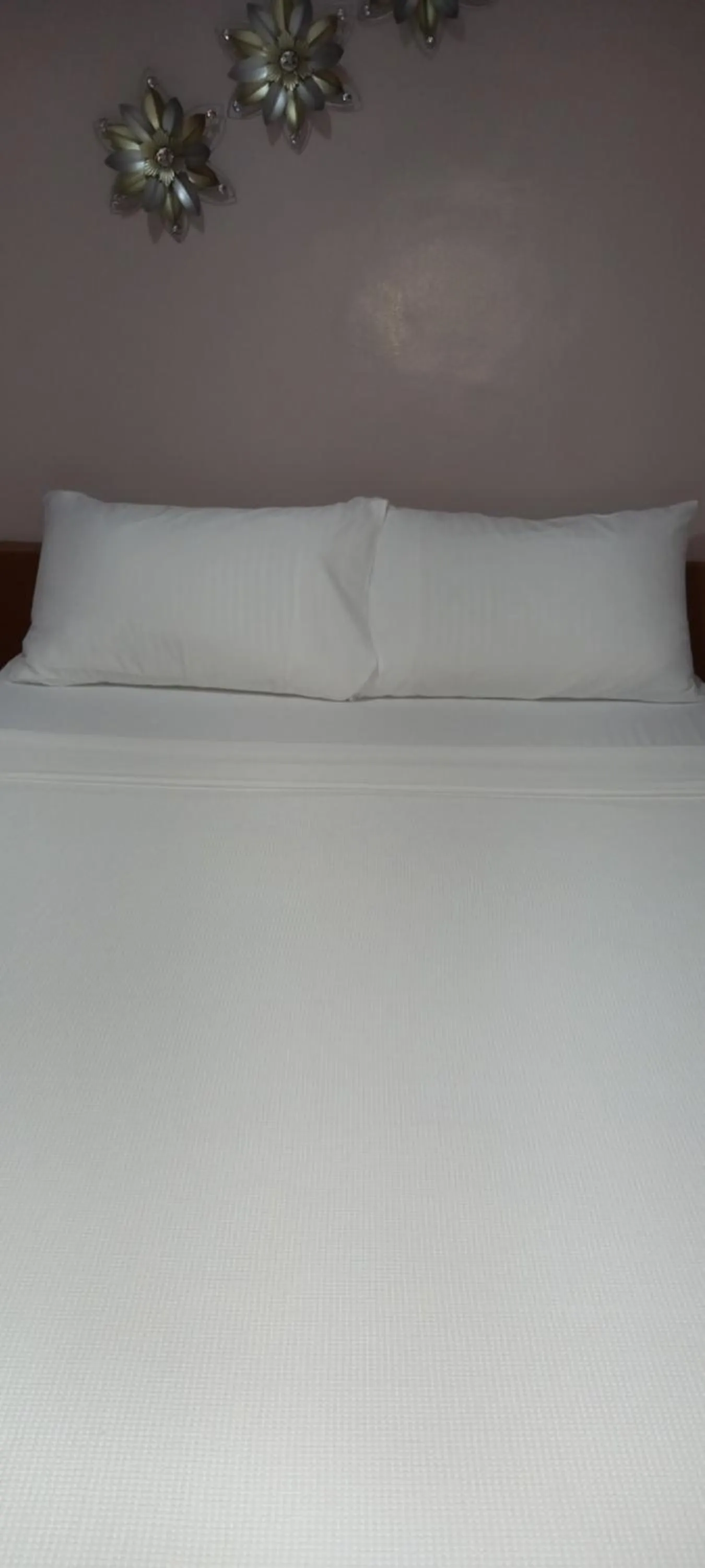 Bed in Lorraine Suites