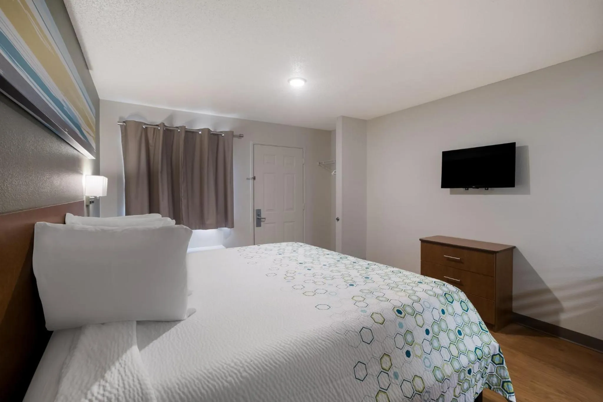 Bedroom, Bed in HomeTowne Studios by Red Roof Covington, GA