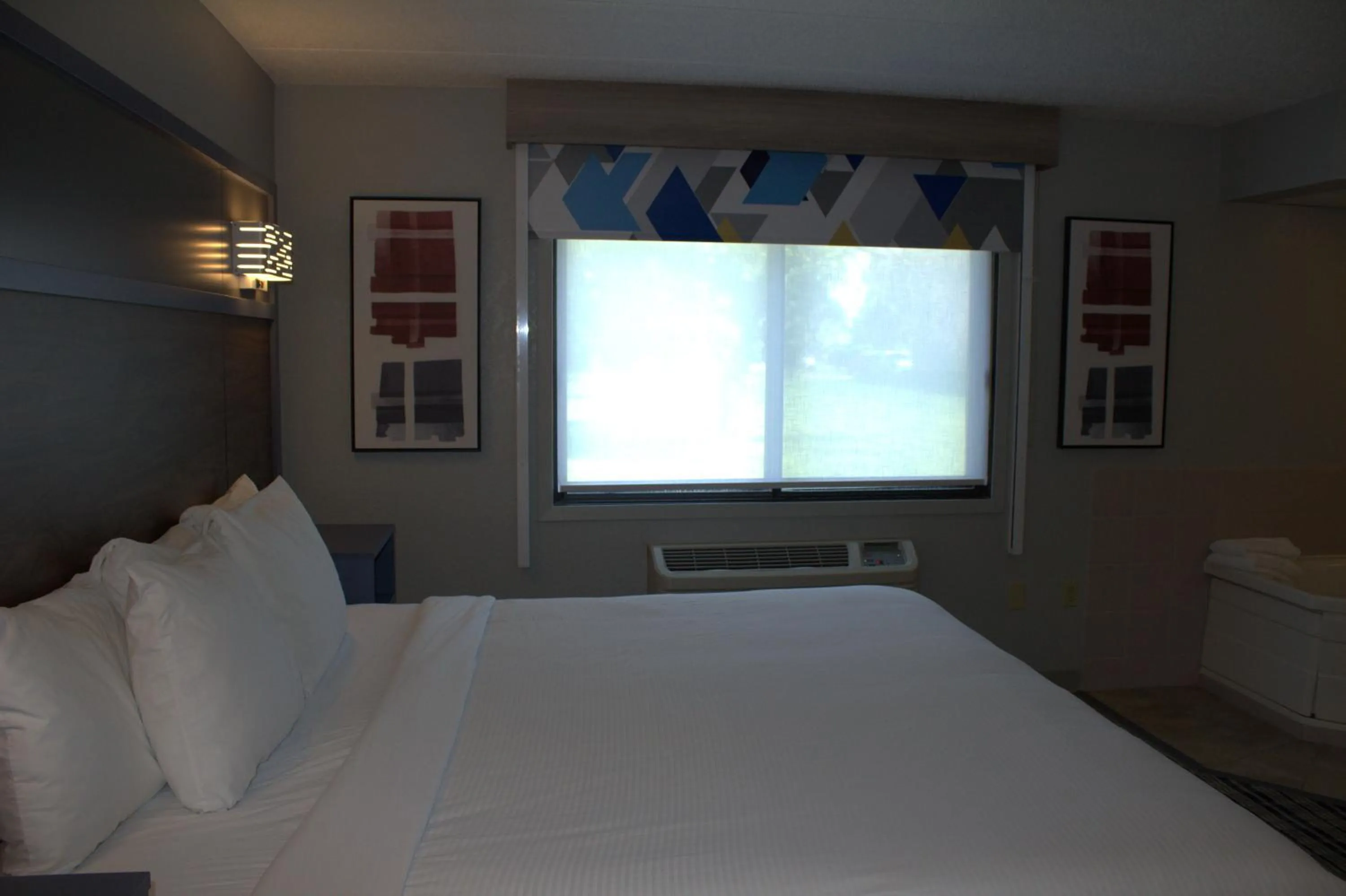 Bed in AmericInn by Wyndham Worthington
