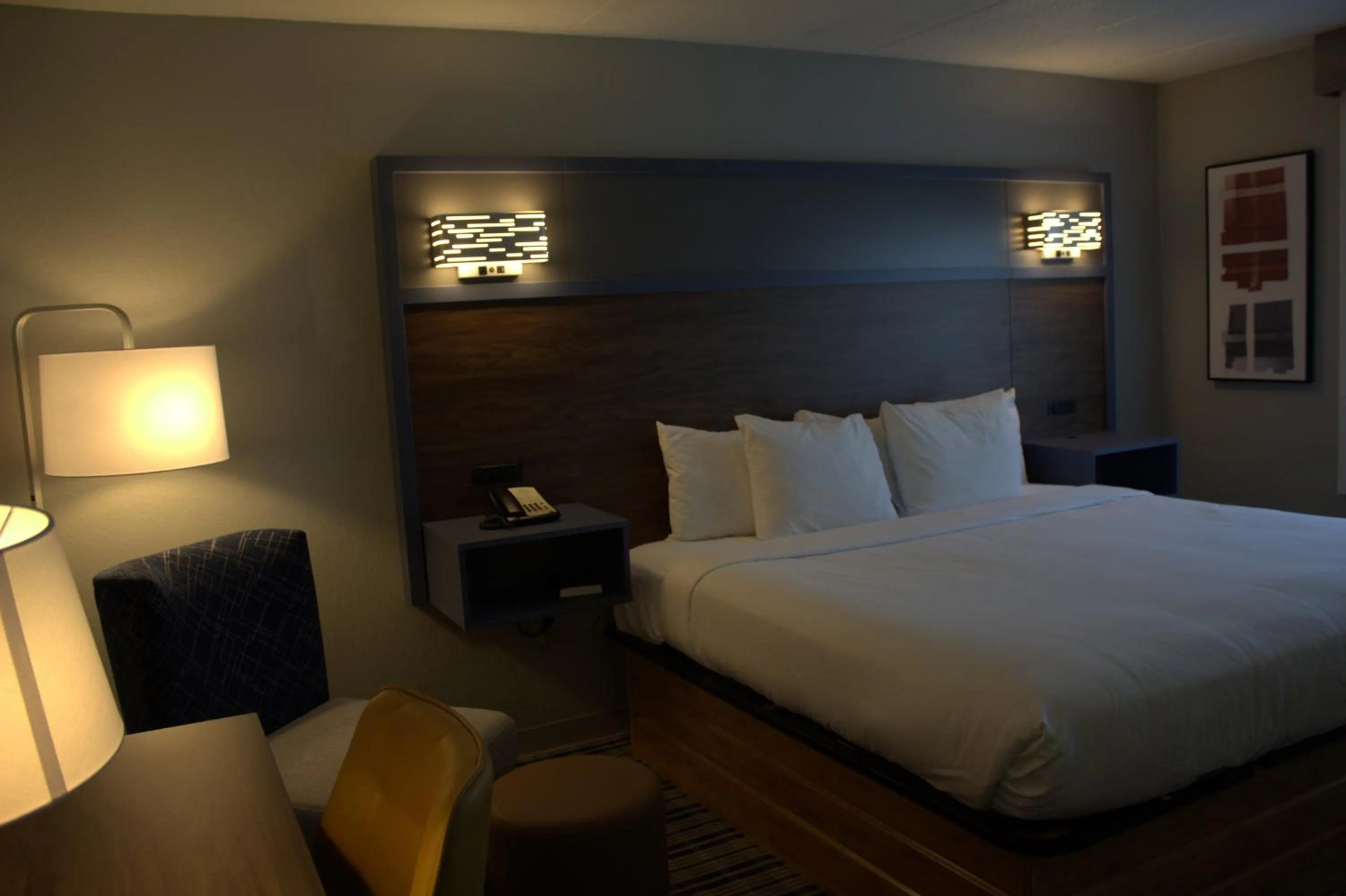 Bed in AmericInn by Wyndham Worthington