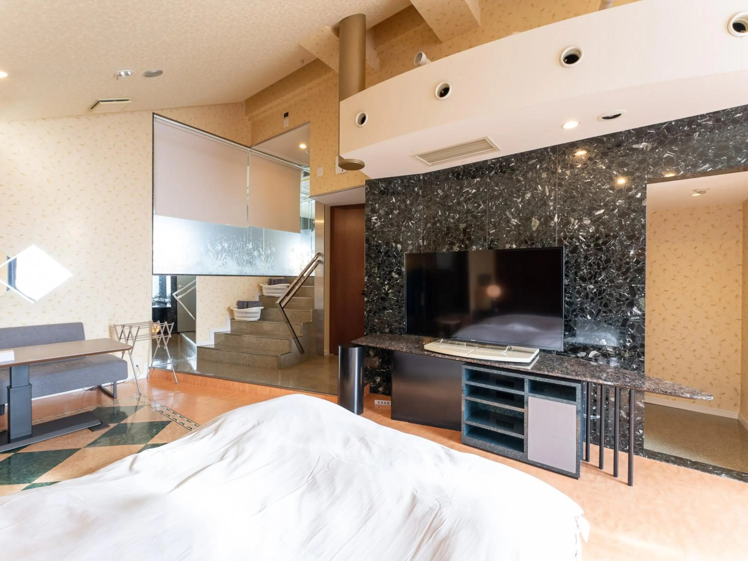 Bed in Tabist Shizukuishi Resort Hotel