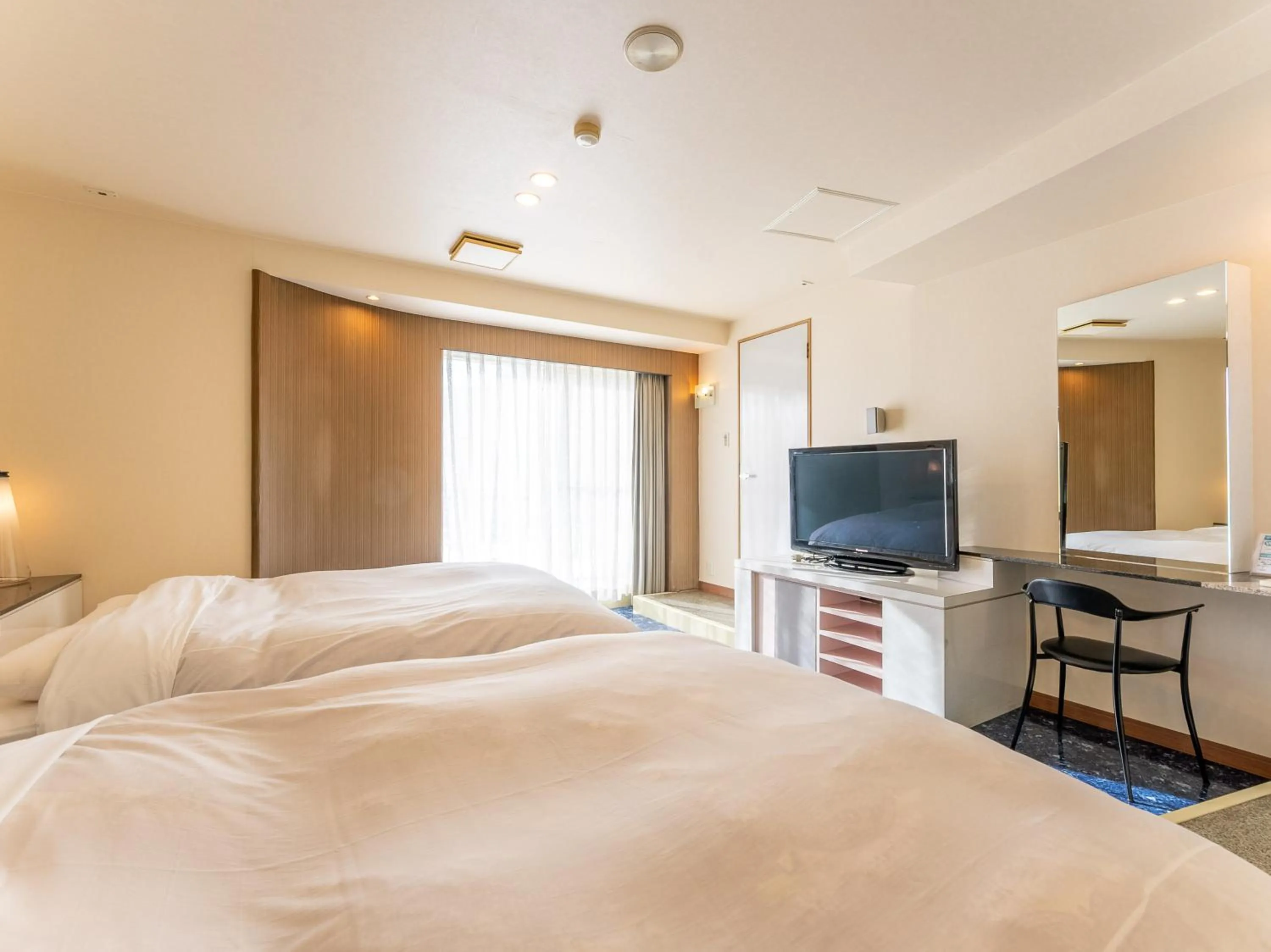 Bed in Tabist Shizukuishi Resort Hotel