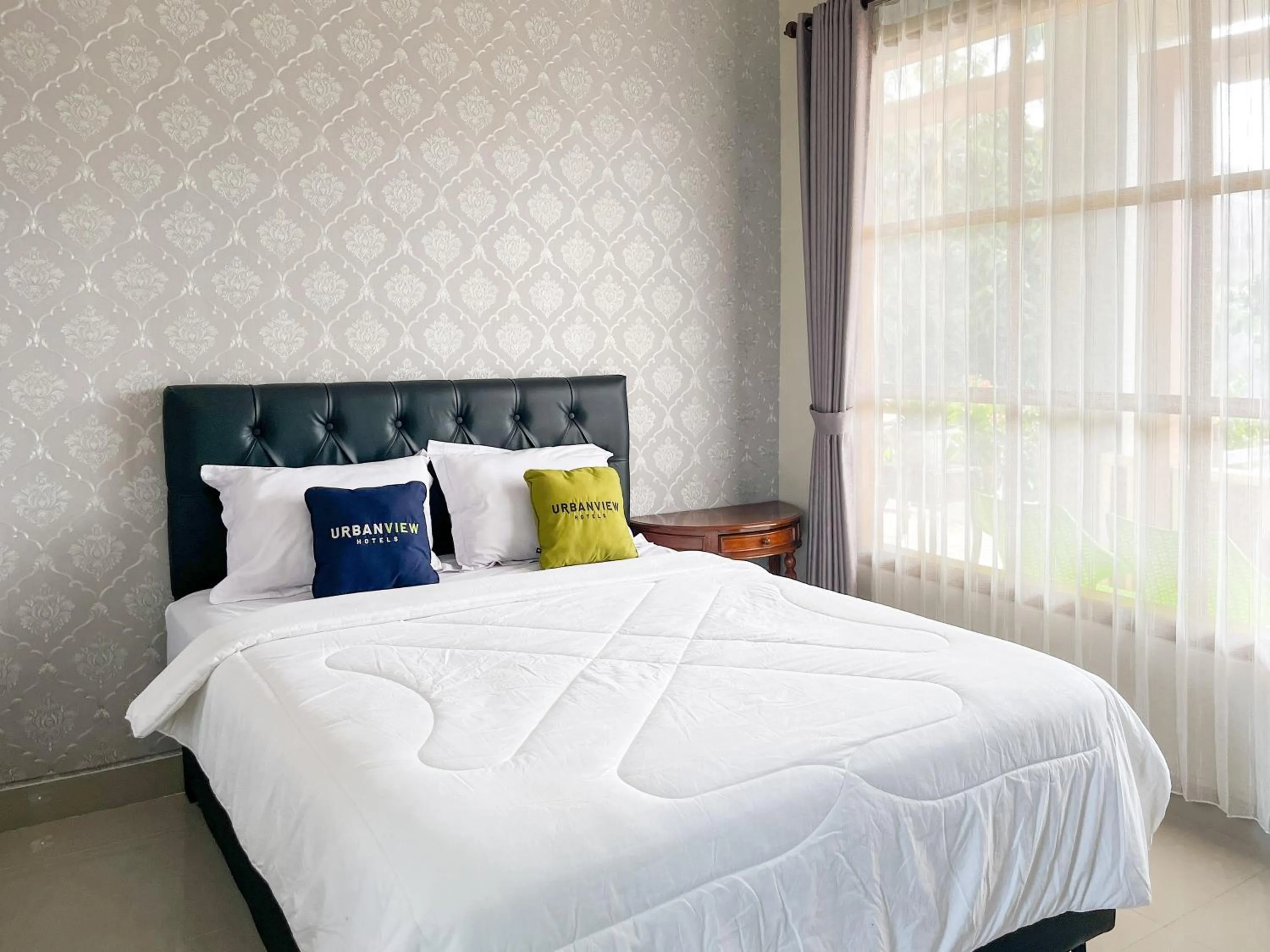 Bed in Urbanview Syariah Hotel Kanigara Batu