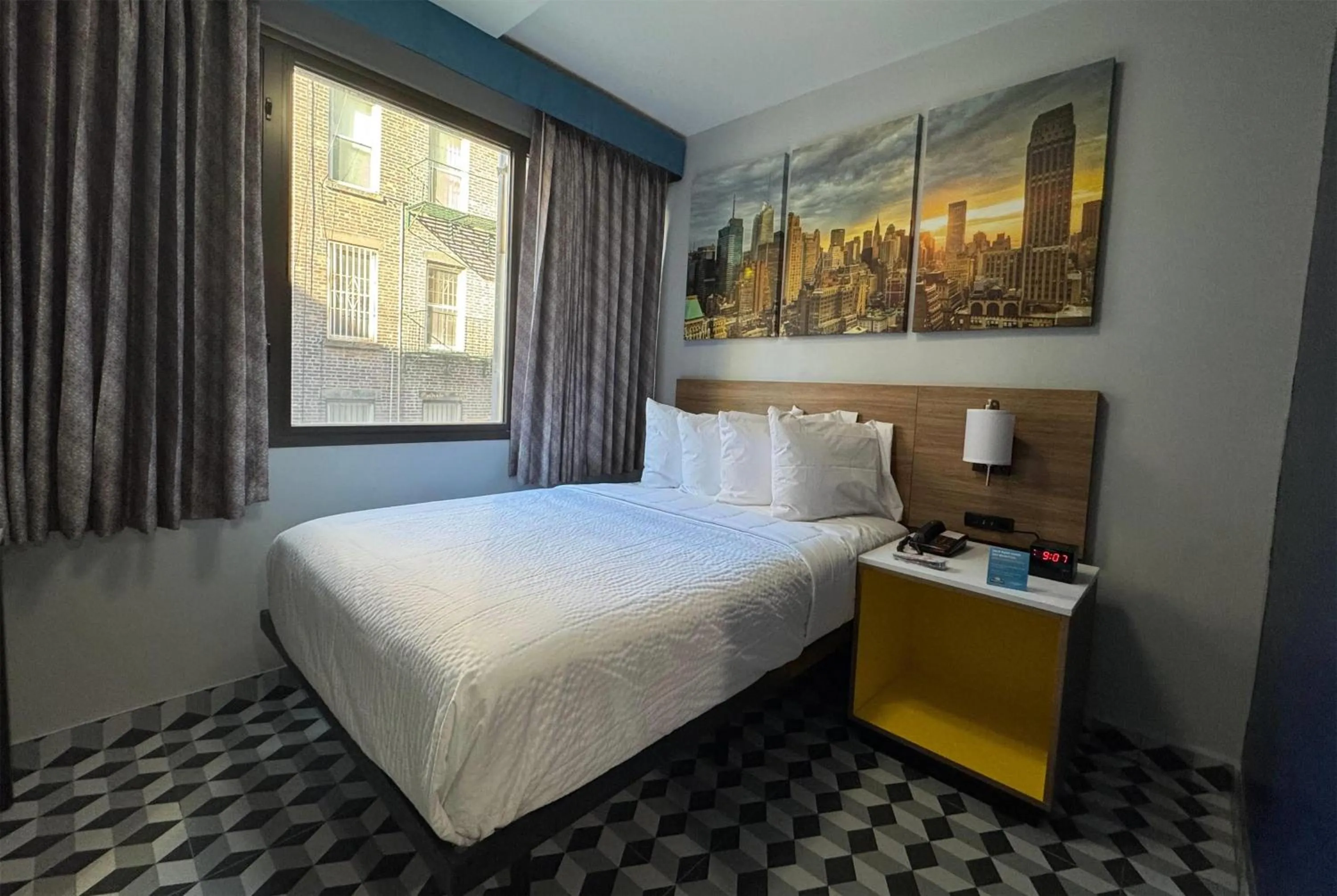 Photo of the whole room, Bed in Days Inn by Wyndham New York Chinatown