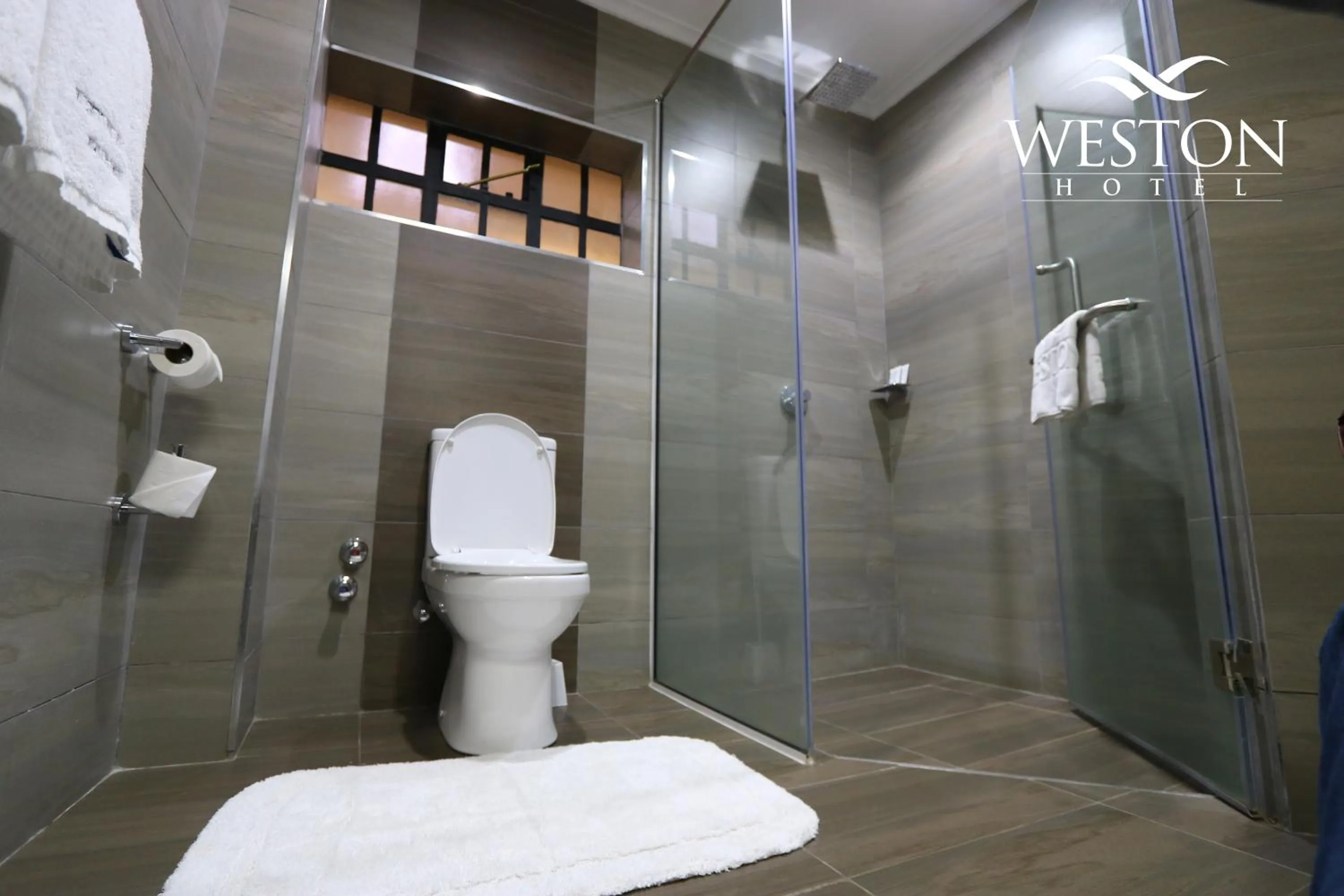 Toilet in Weston Hotel