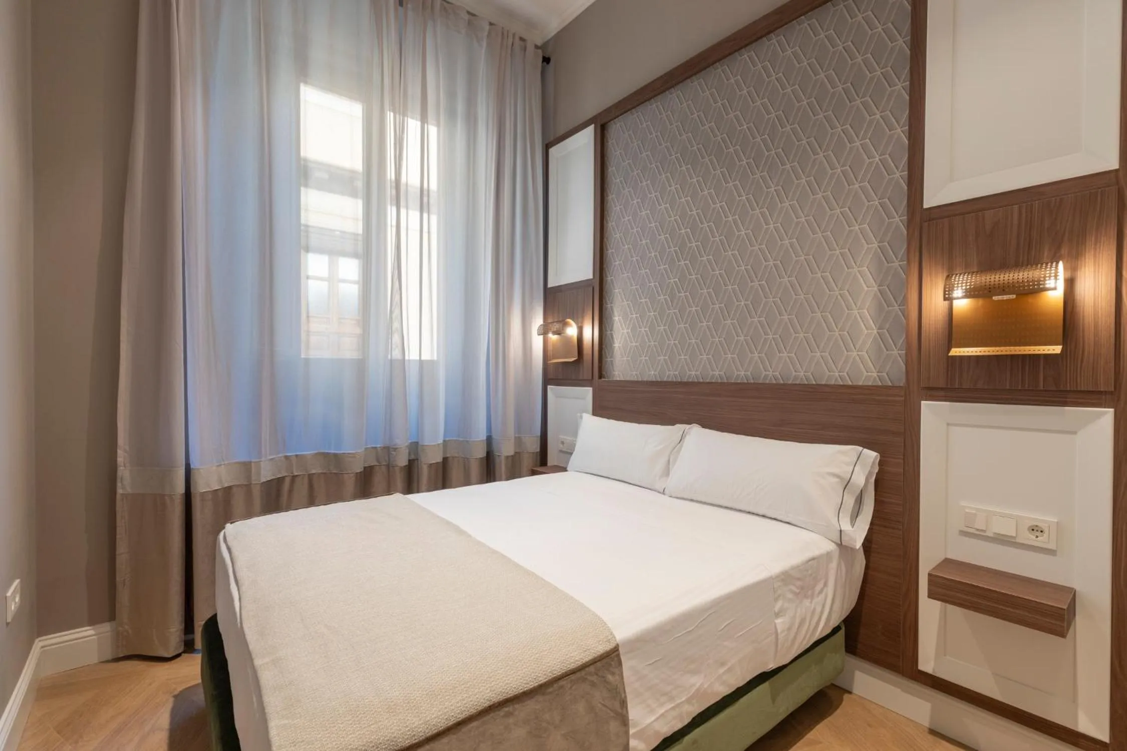 Bed in BiBo Suites Palacio de Portago