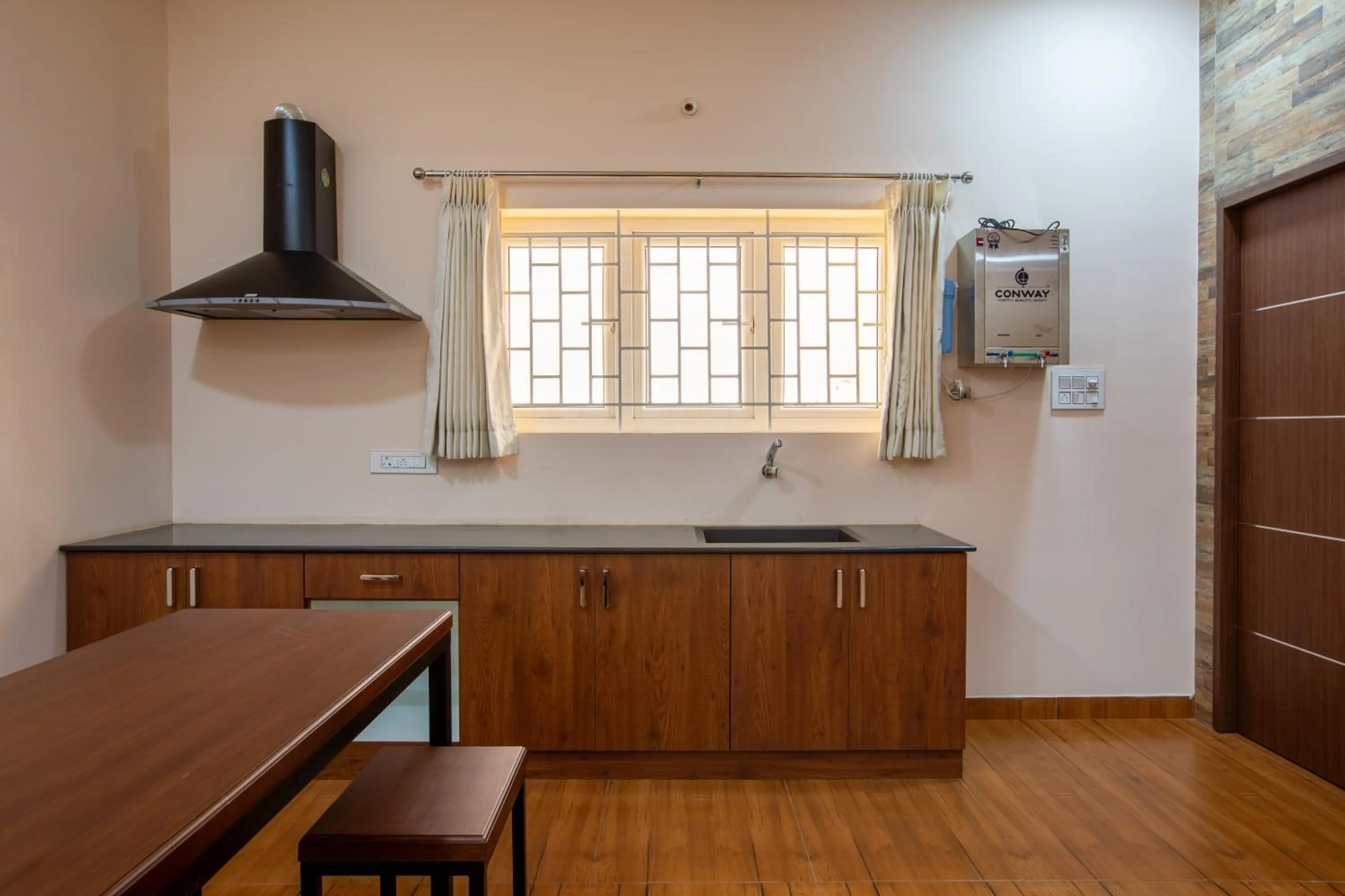 Kitchen or kitchenette in MUGUNDAN 'S SMART STAY