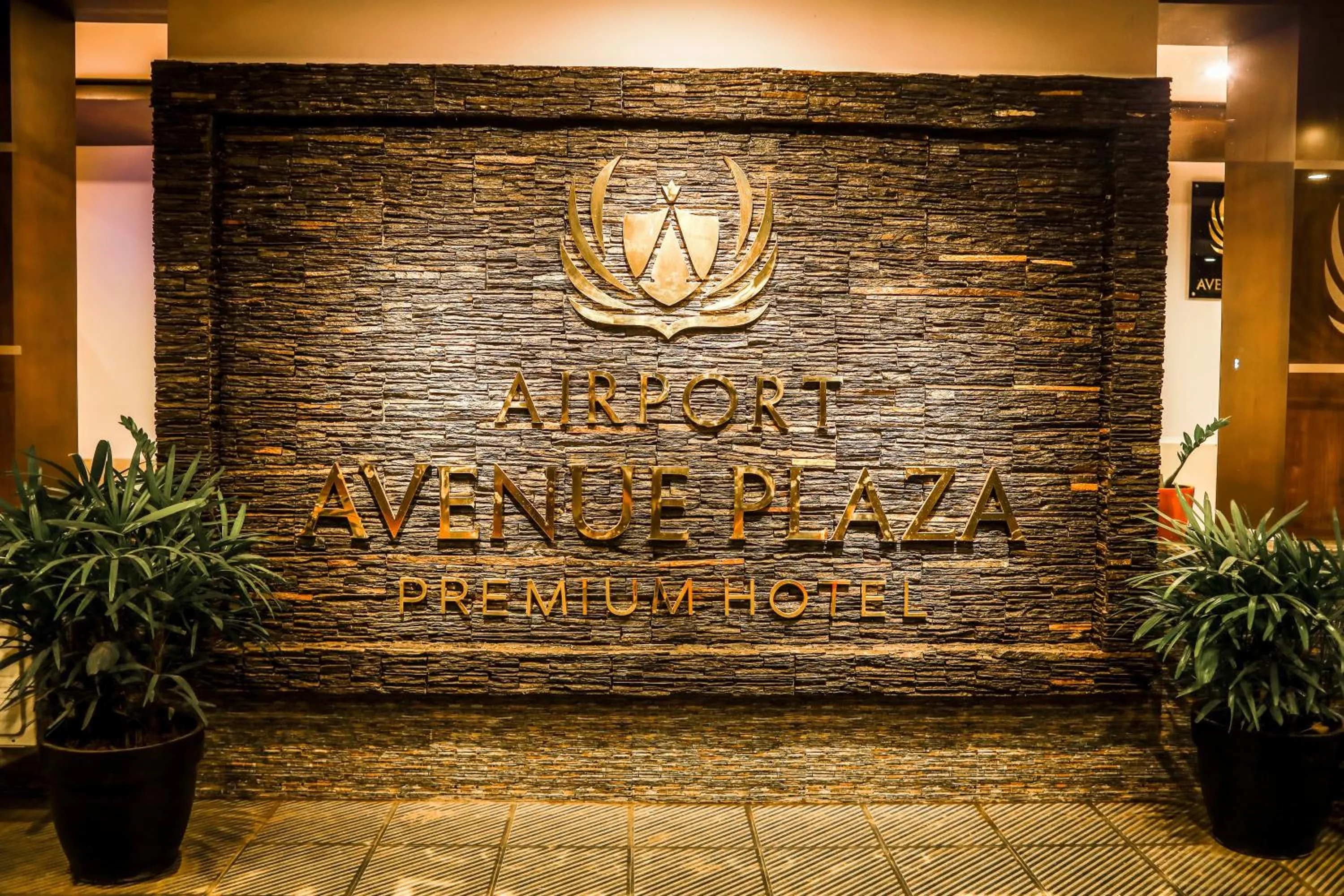 Property logo or sign in Airport Avenue Plaza