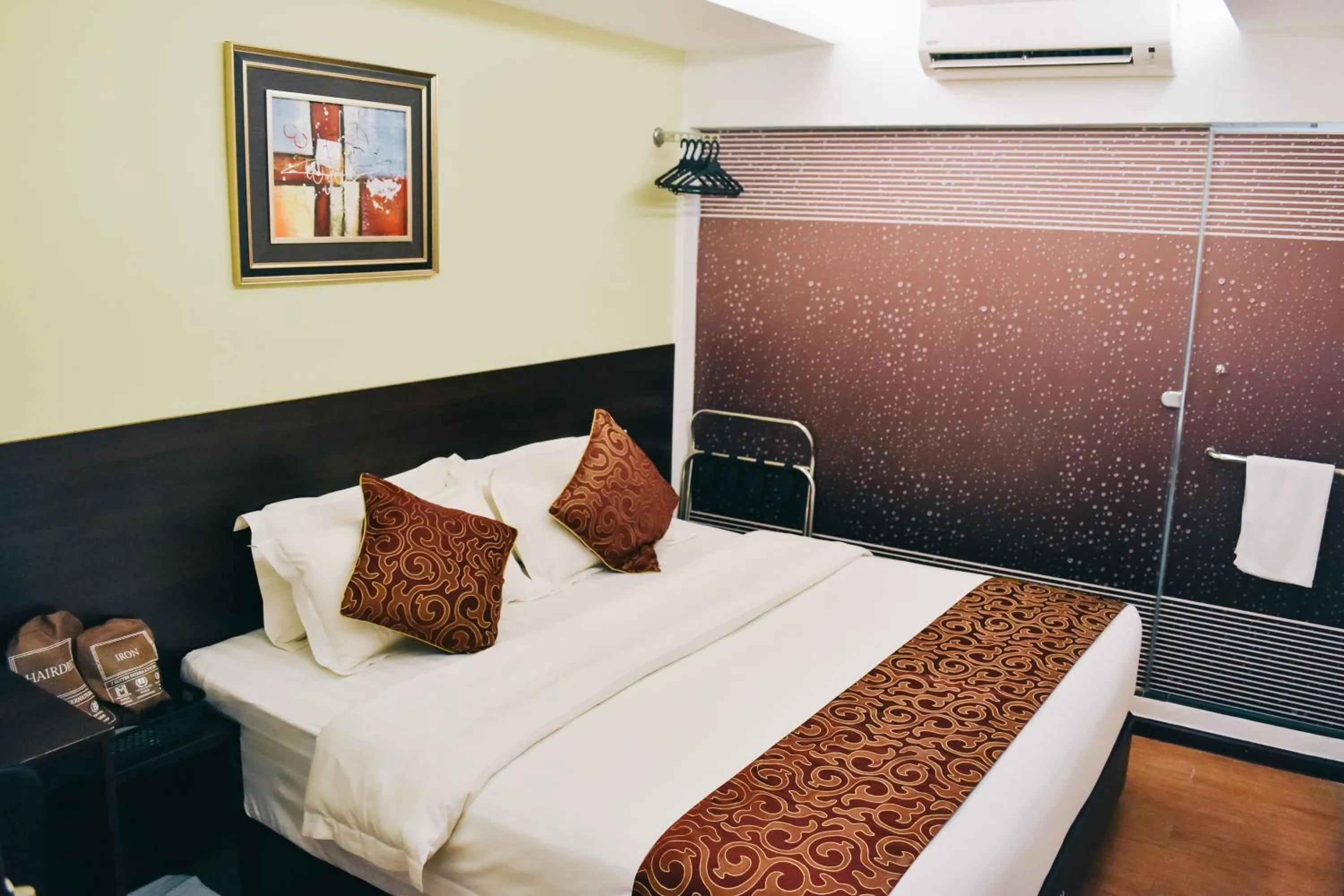 Bed in J Suites Hotel