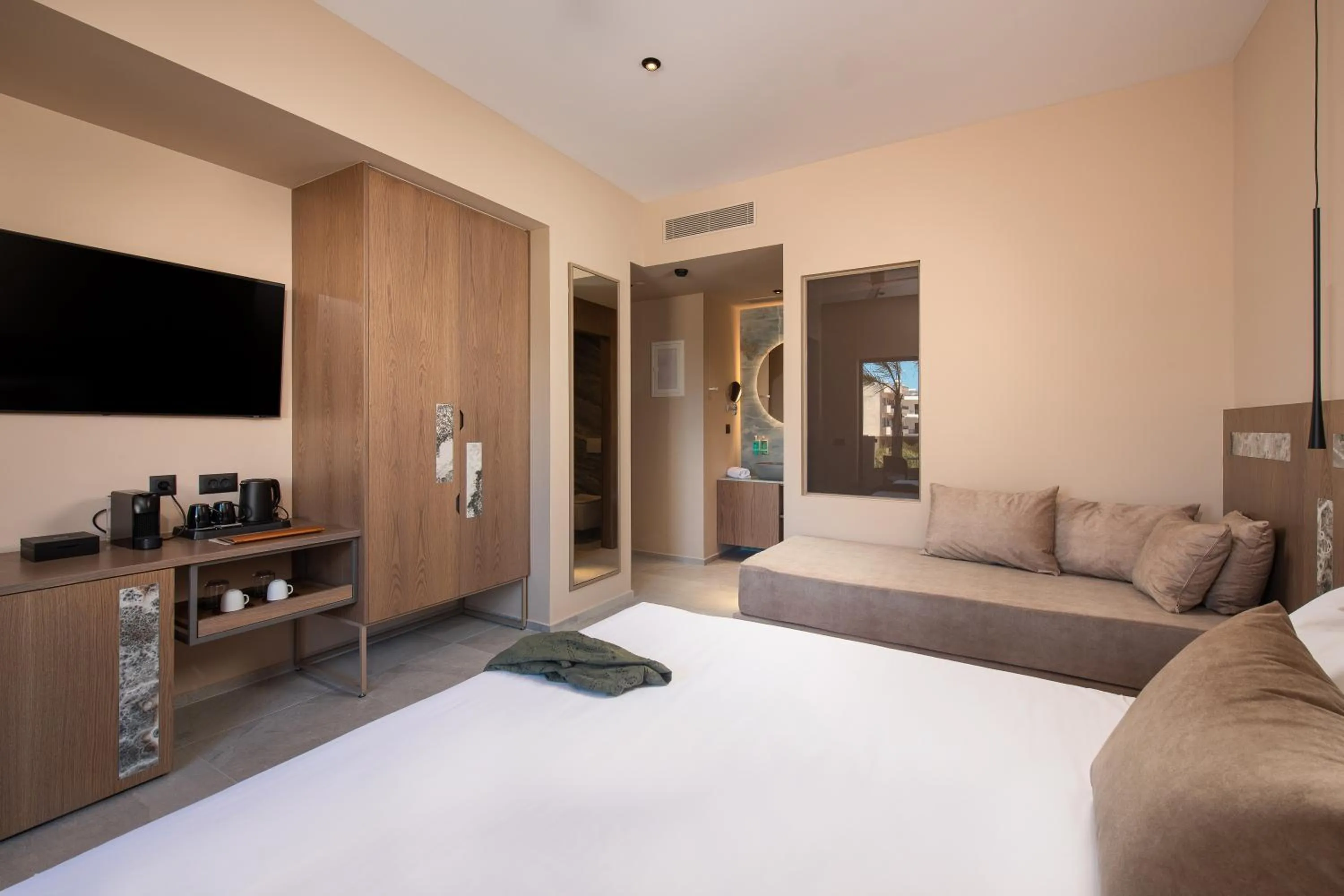 Bed in Cosmeen Lifestyle Boutique Stay