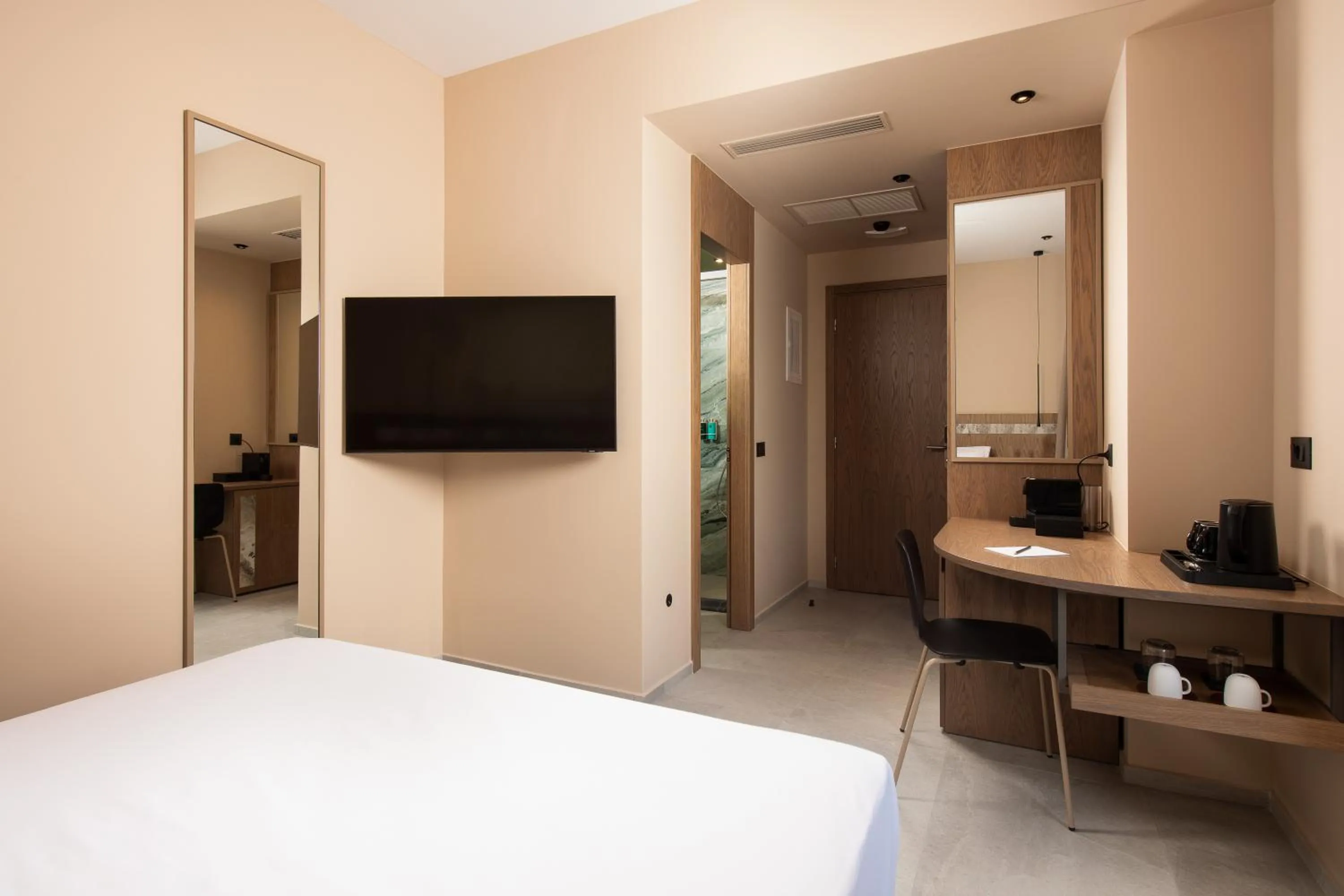 Bed in Cosmeen Lifestyle Boutique Stay