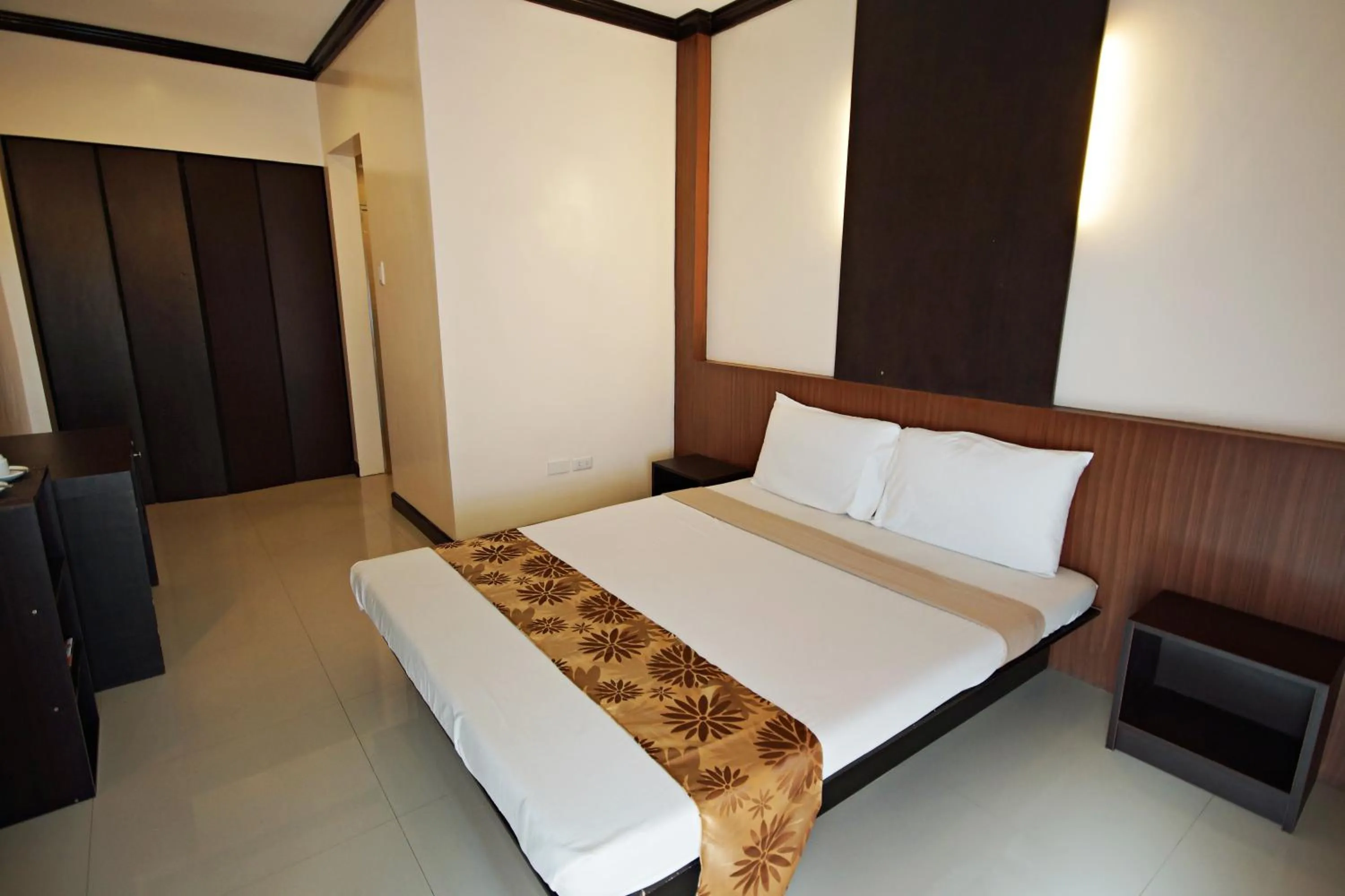 Photo of the whole room, Bed in Pacific Palm Suites Davao powered by Cocotel