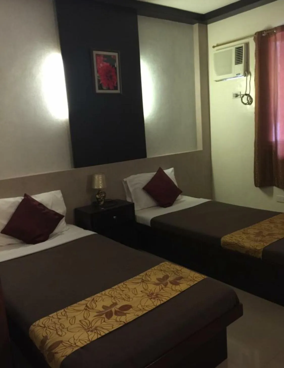 Bed in Pacific Palm Suites Davao powered by Cocotel