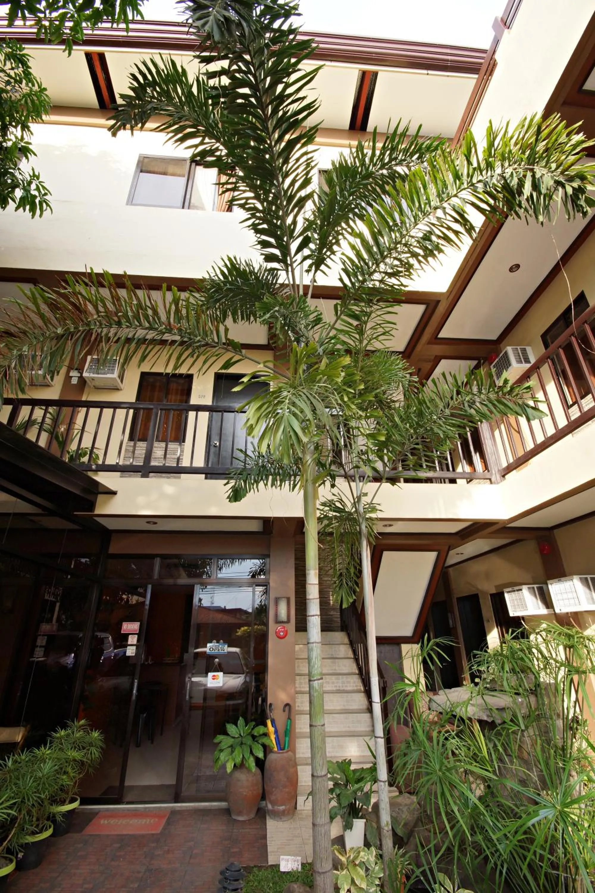 Facade/entrance in Pacific Palm Suites Davao powered by Cocotel