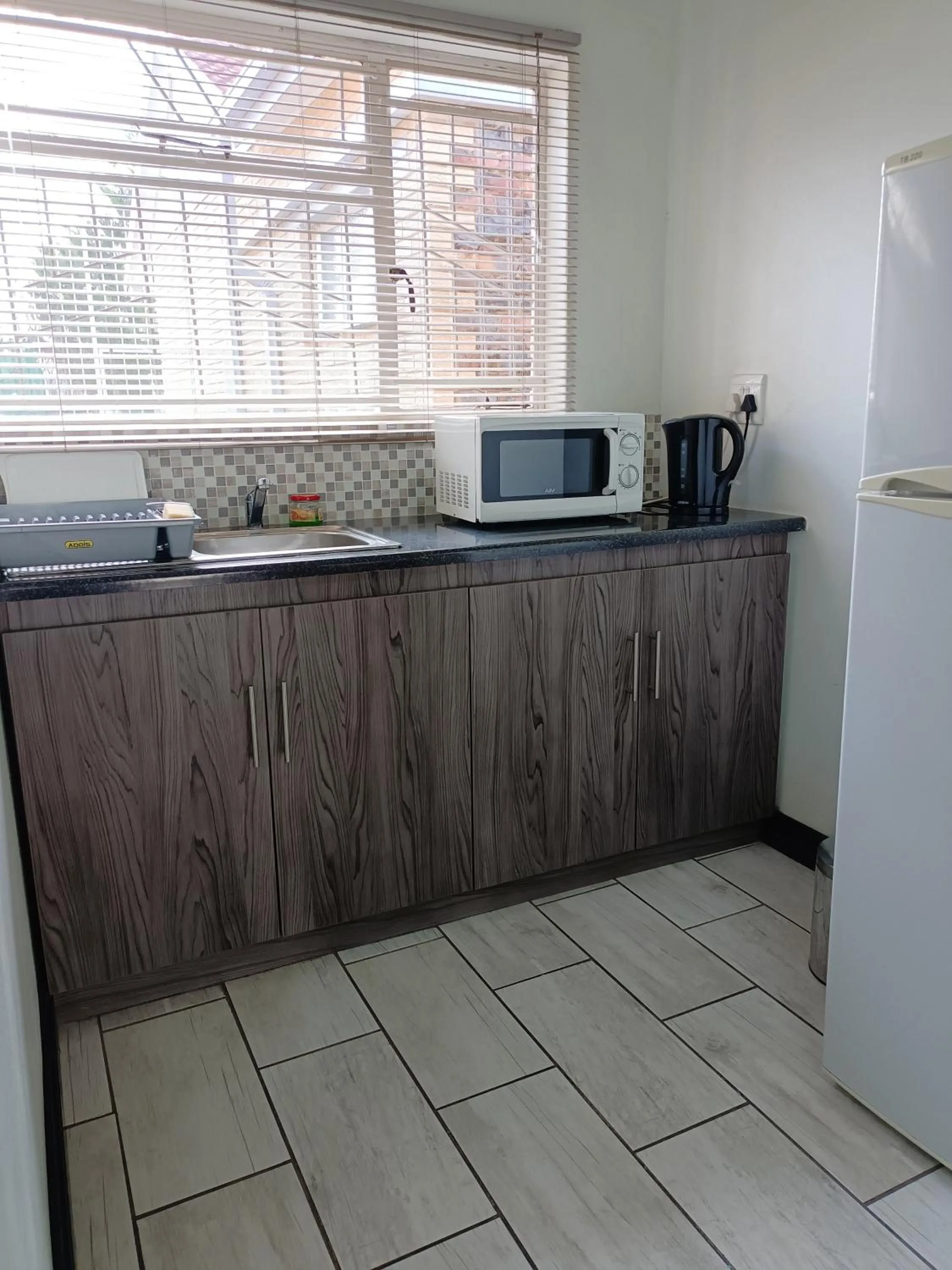 Kitchen or kitchenette in 21 On Coetzee Guest House