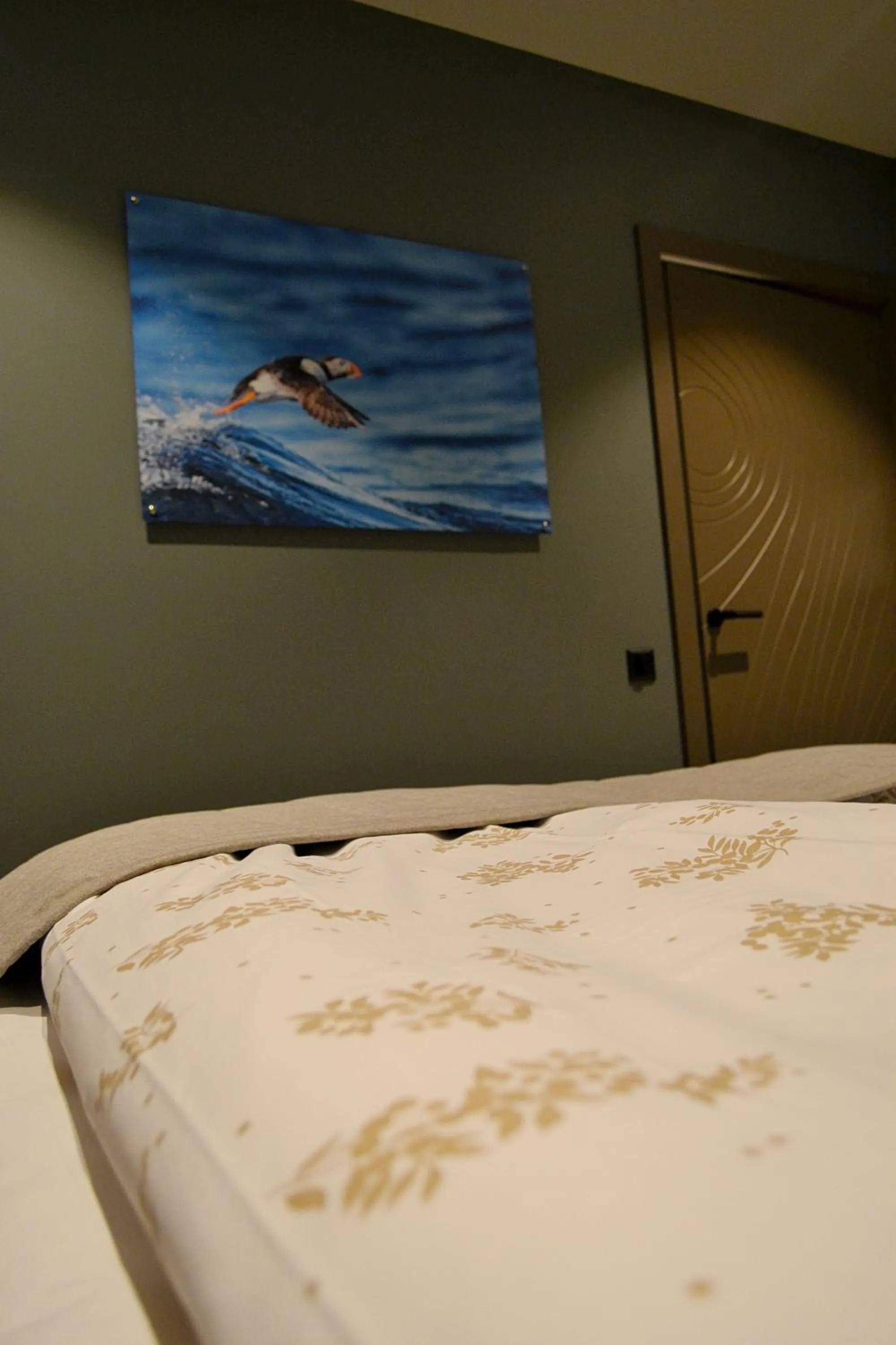 Bed in Andenes Suitehotel