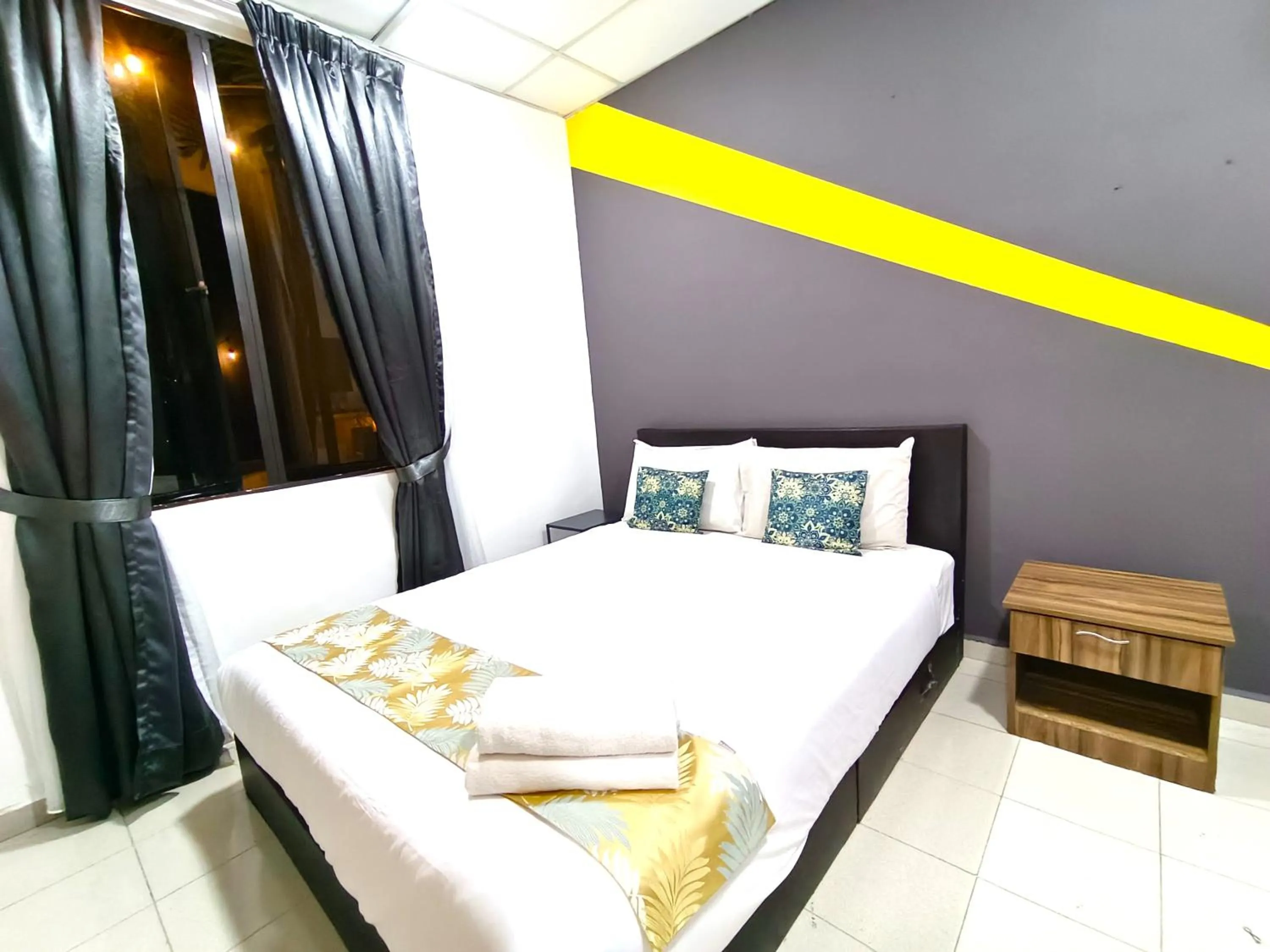 Bed in Salaam Suites Hotel