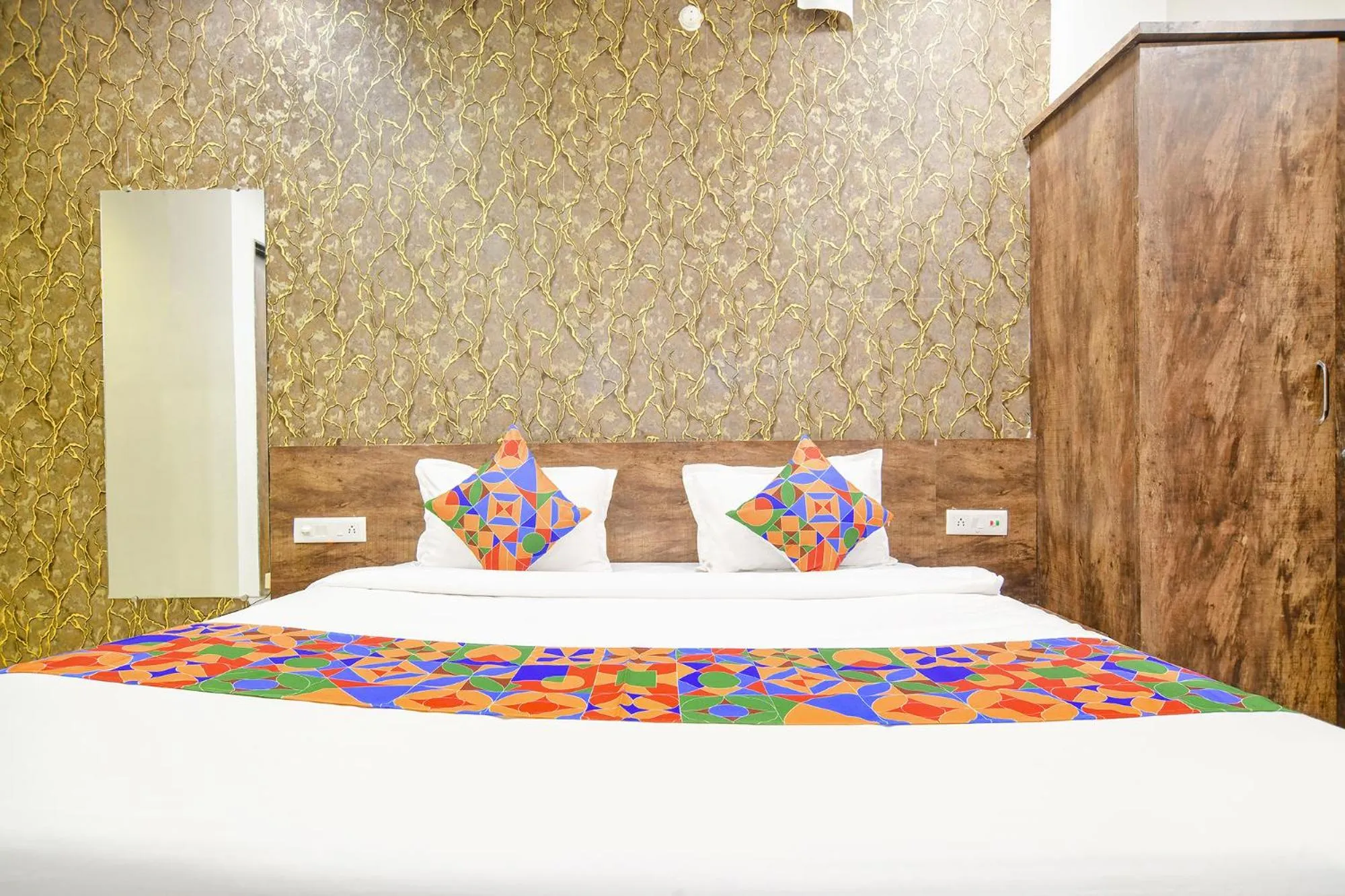 Bed in FabHotel Sage Residency