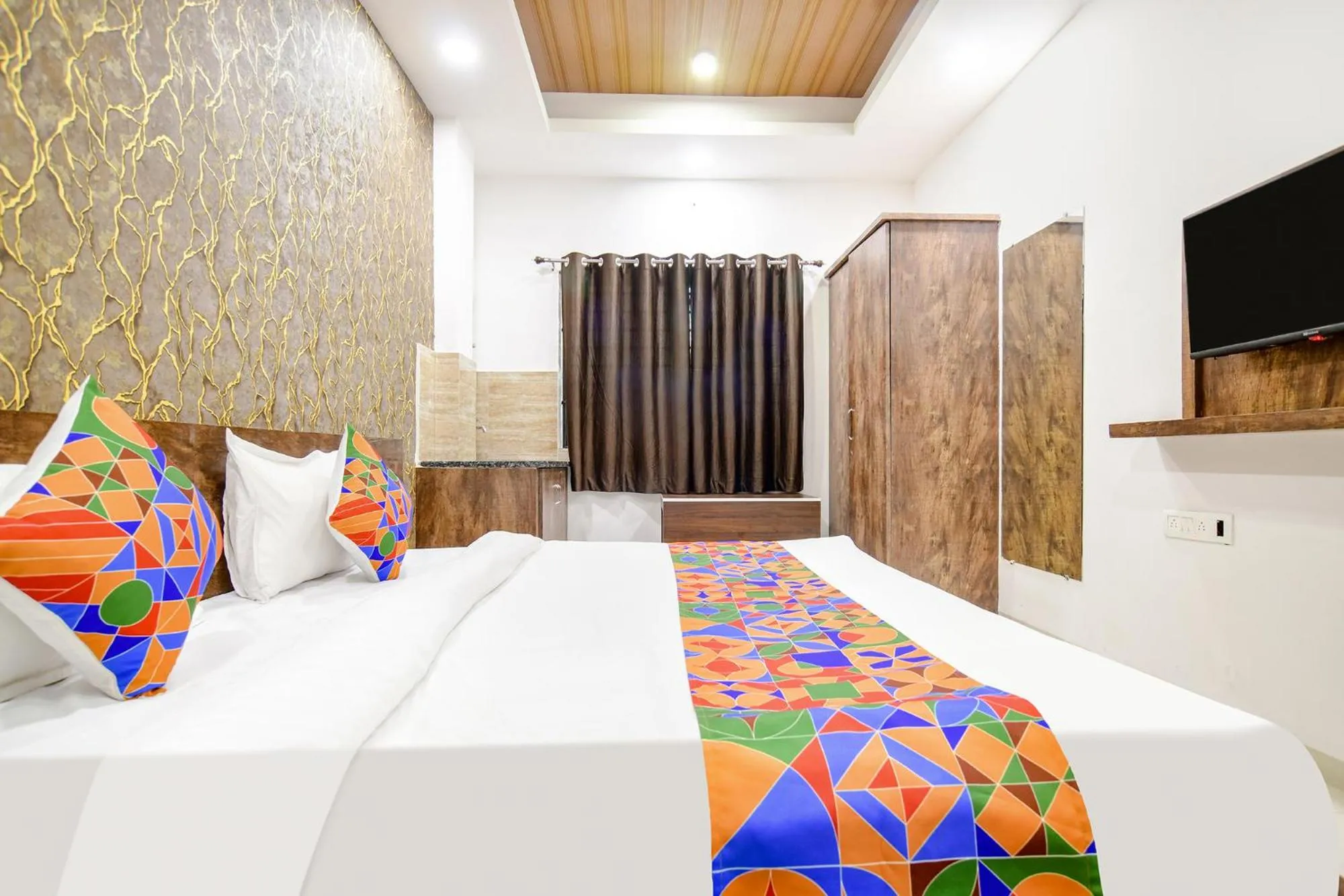 Bed in FabHotel Sage Residency