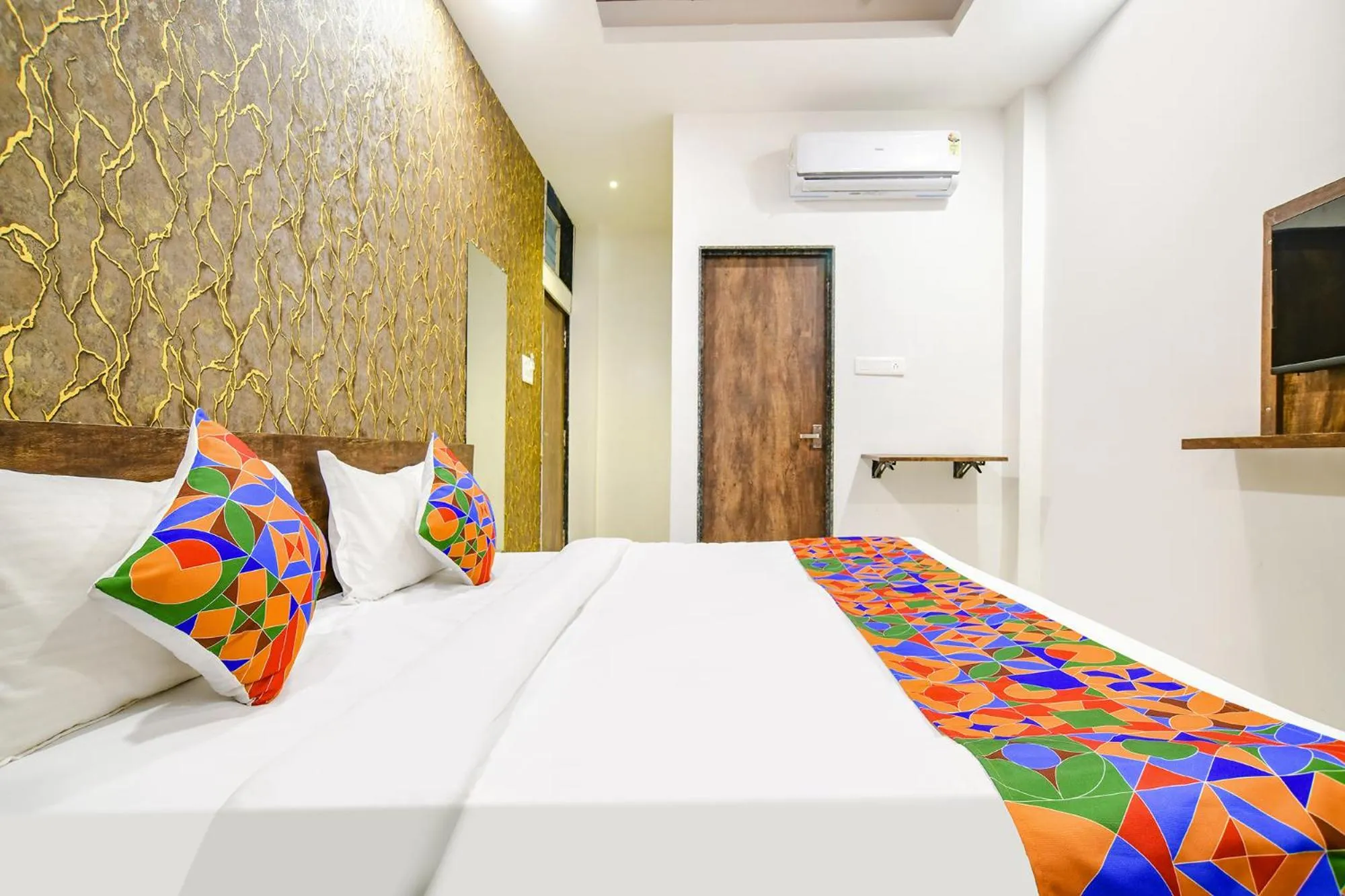 Bed in FabHotel Sage Residency