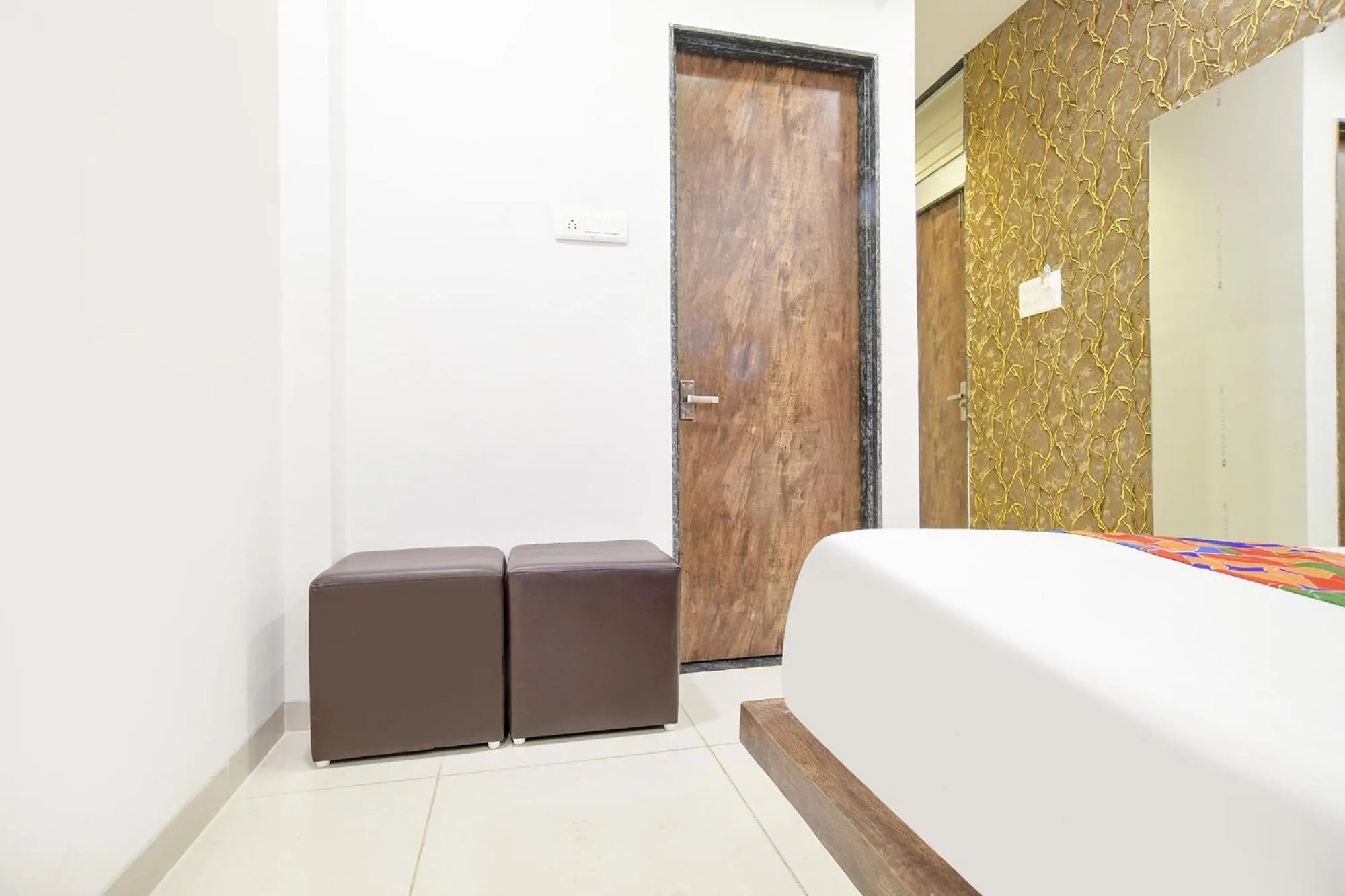 Bed in FabHotel Sage Residency