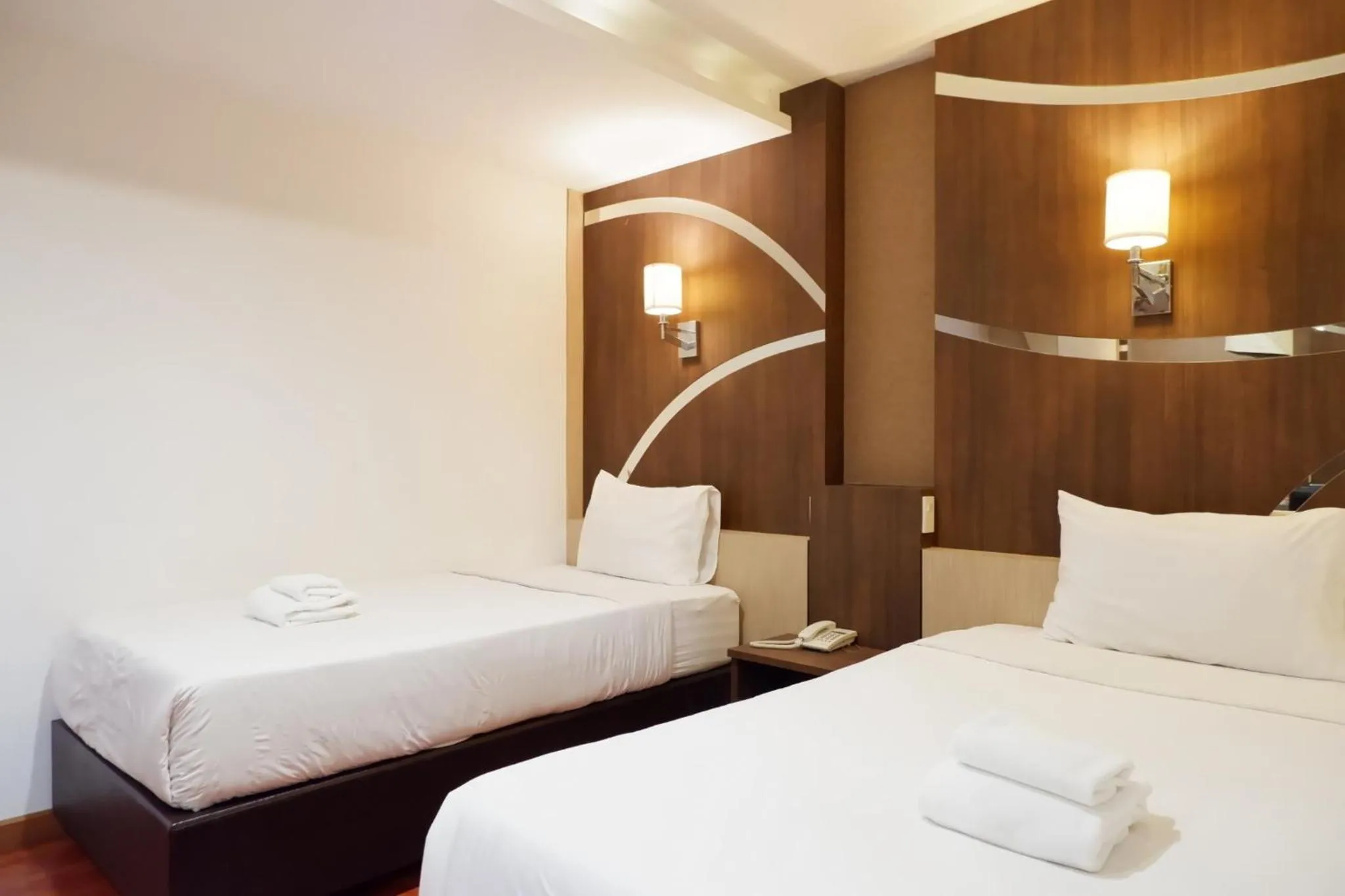 Bed in Delio Boutique Hotel