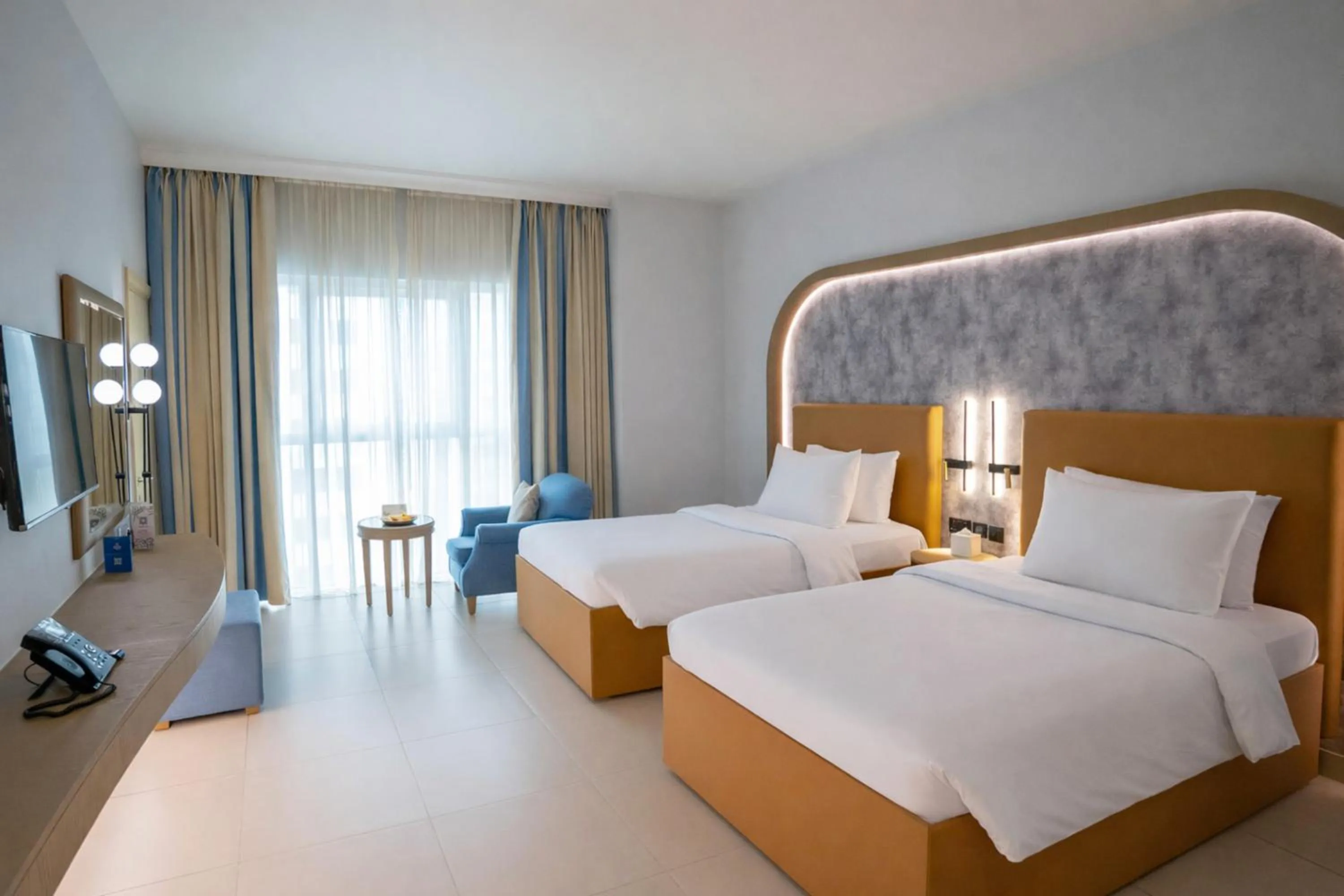 Bed in Sheraton Khalidiya Hotel