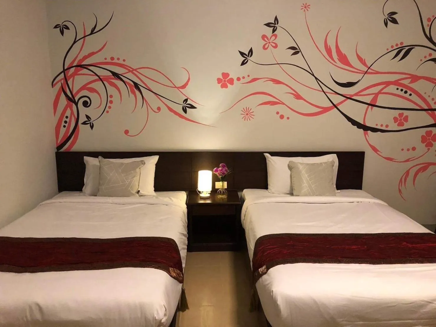 Bed in NAKA GUEST HOUSE