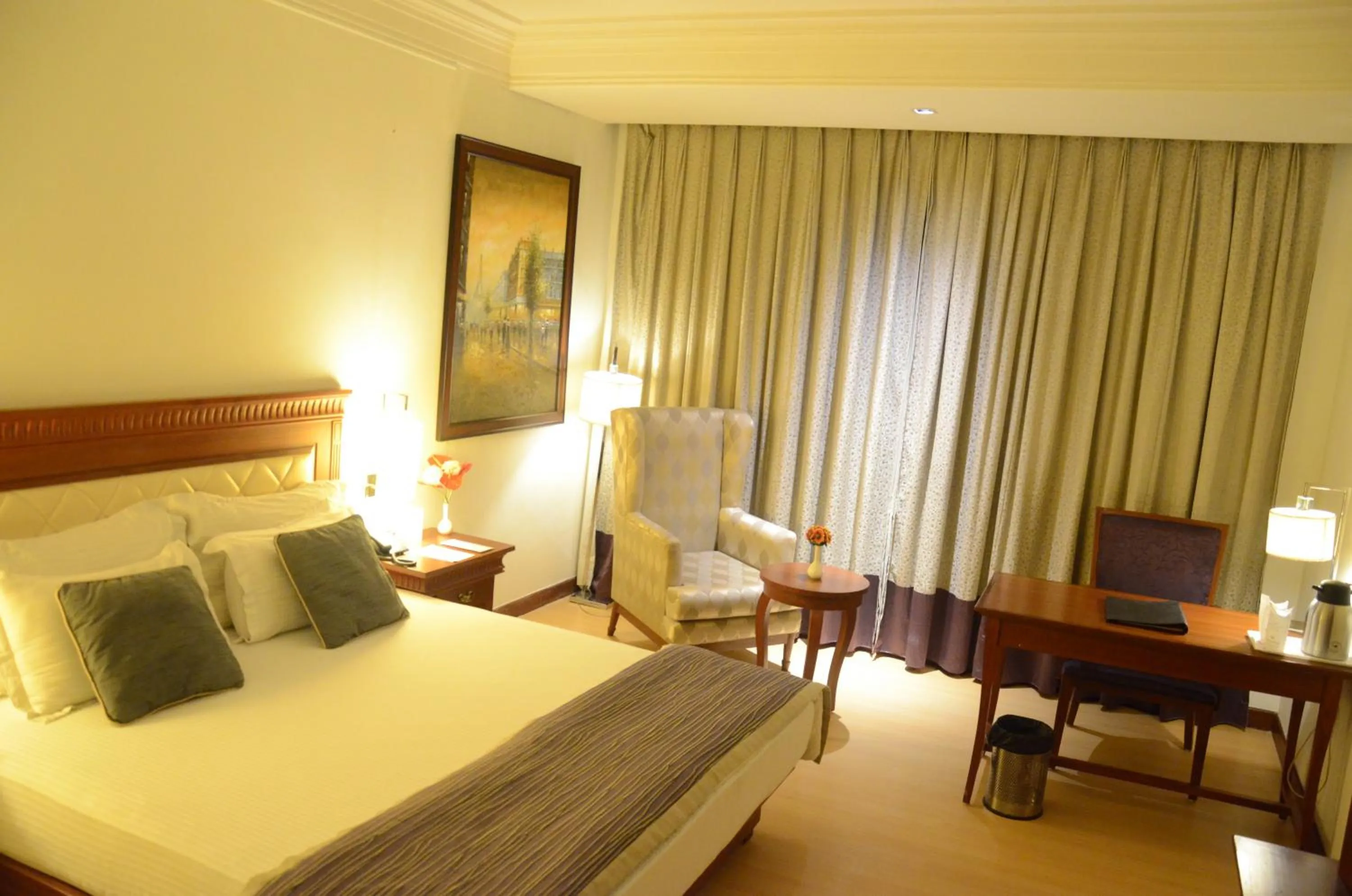 Bed in Chanakya Bnr Hotel