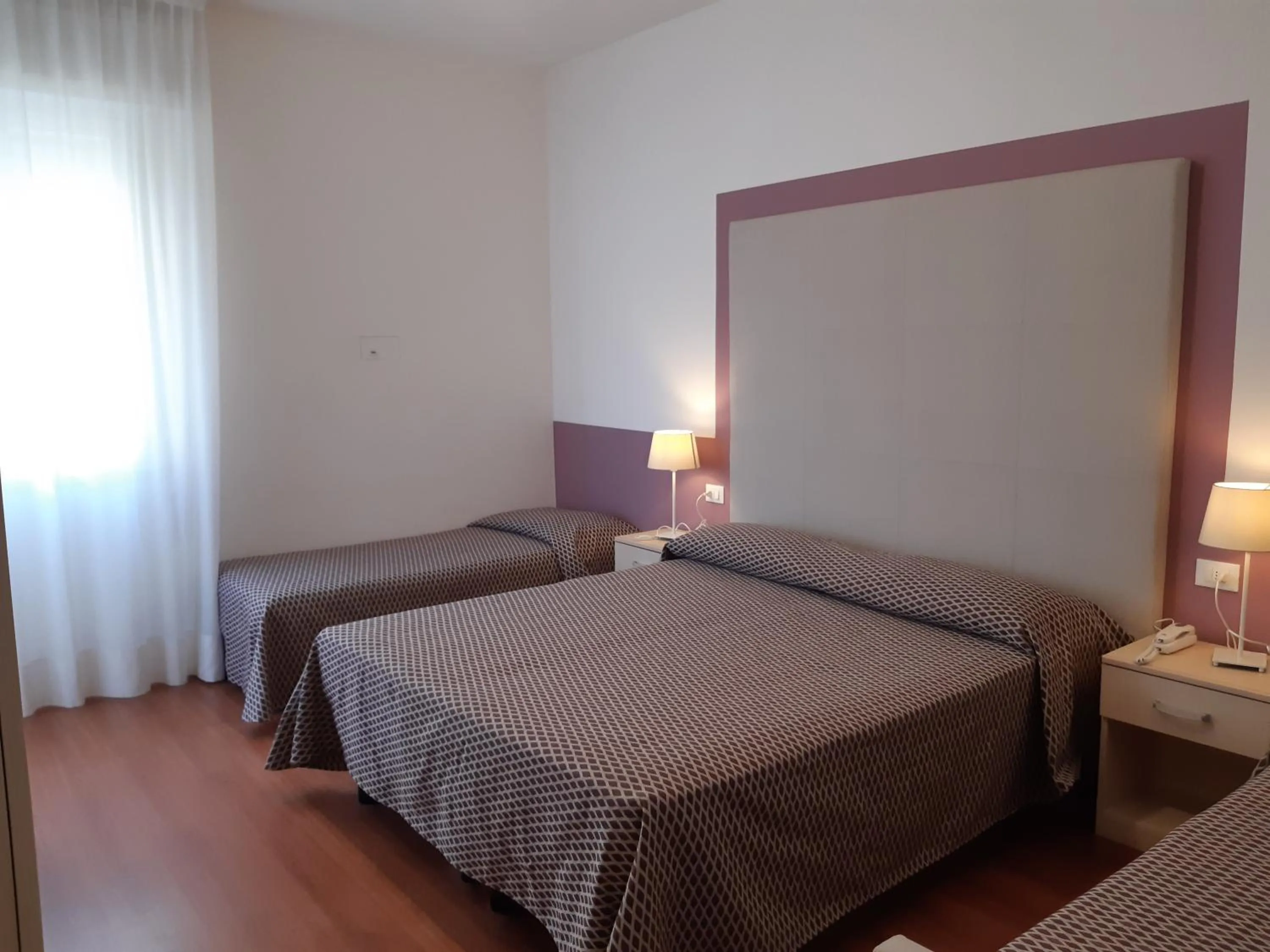 Bed in Hotel Telenia